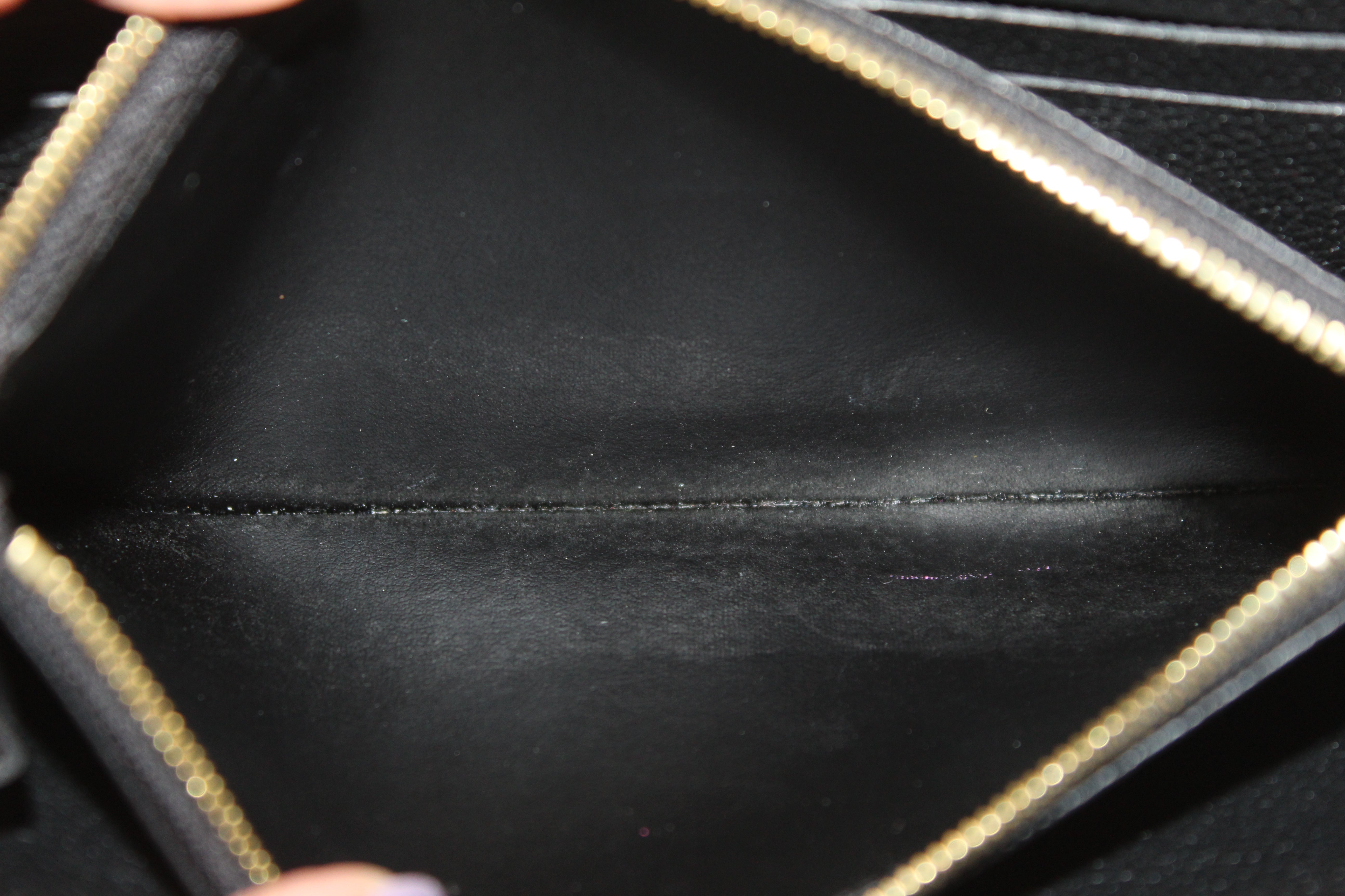 Authentic Louis Vuitton Black Monogram Empreinte Leather Zippy Wallet