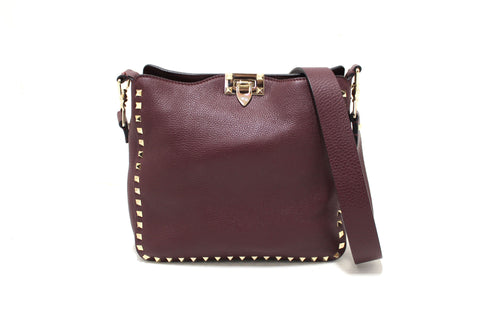Authentic Valentino Garavani Burgundy Pebbled Leather Rockstud Flip-lock Messenger Bag