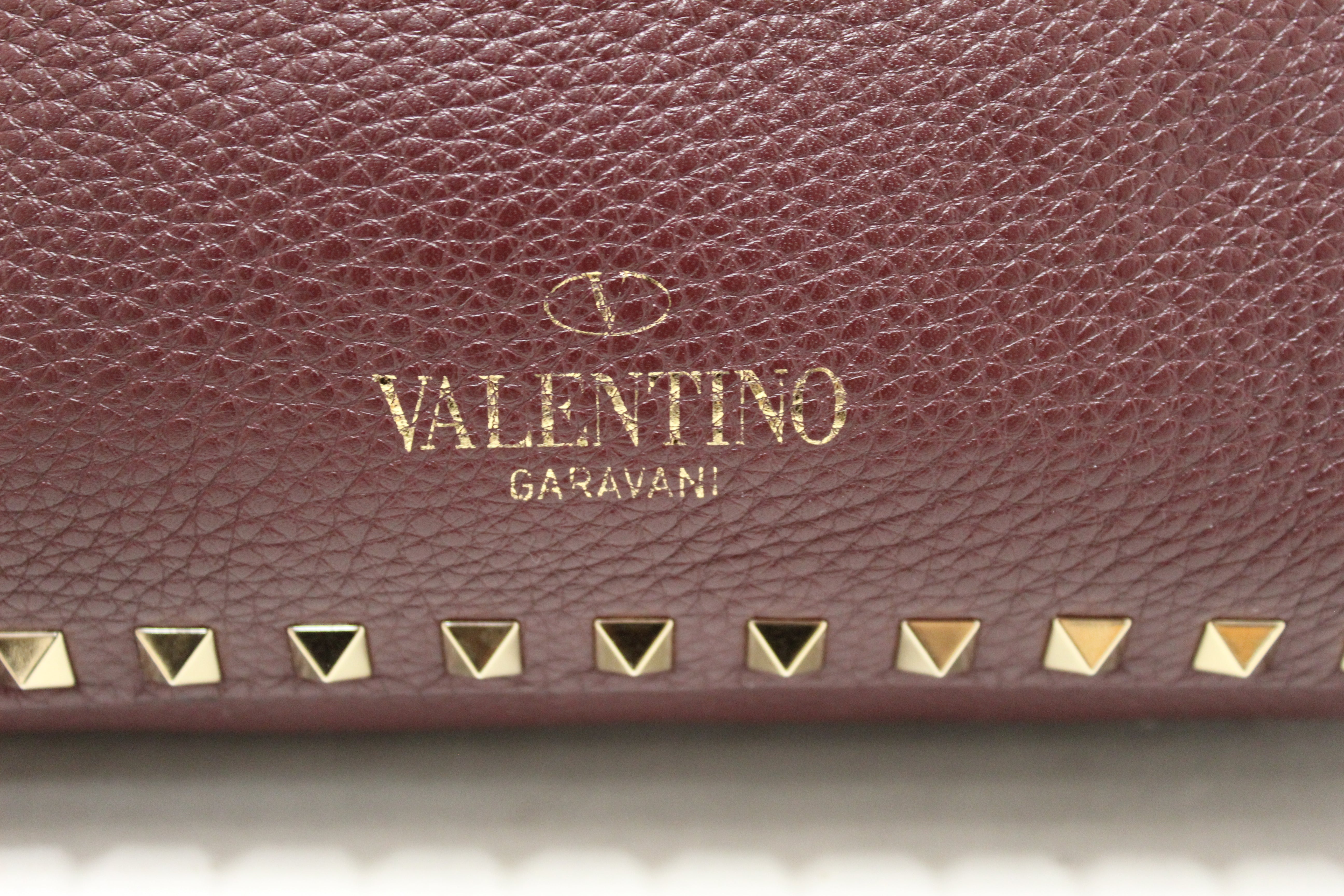 Authentic Valentino Garavani Burgandy Pebbled Leather Rockstud Flip-lock Messenger Bag