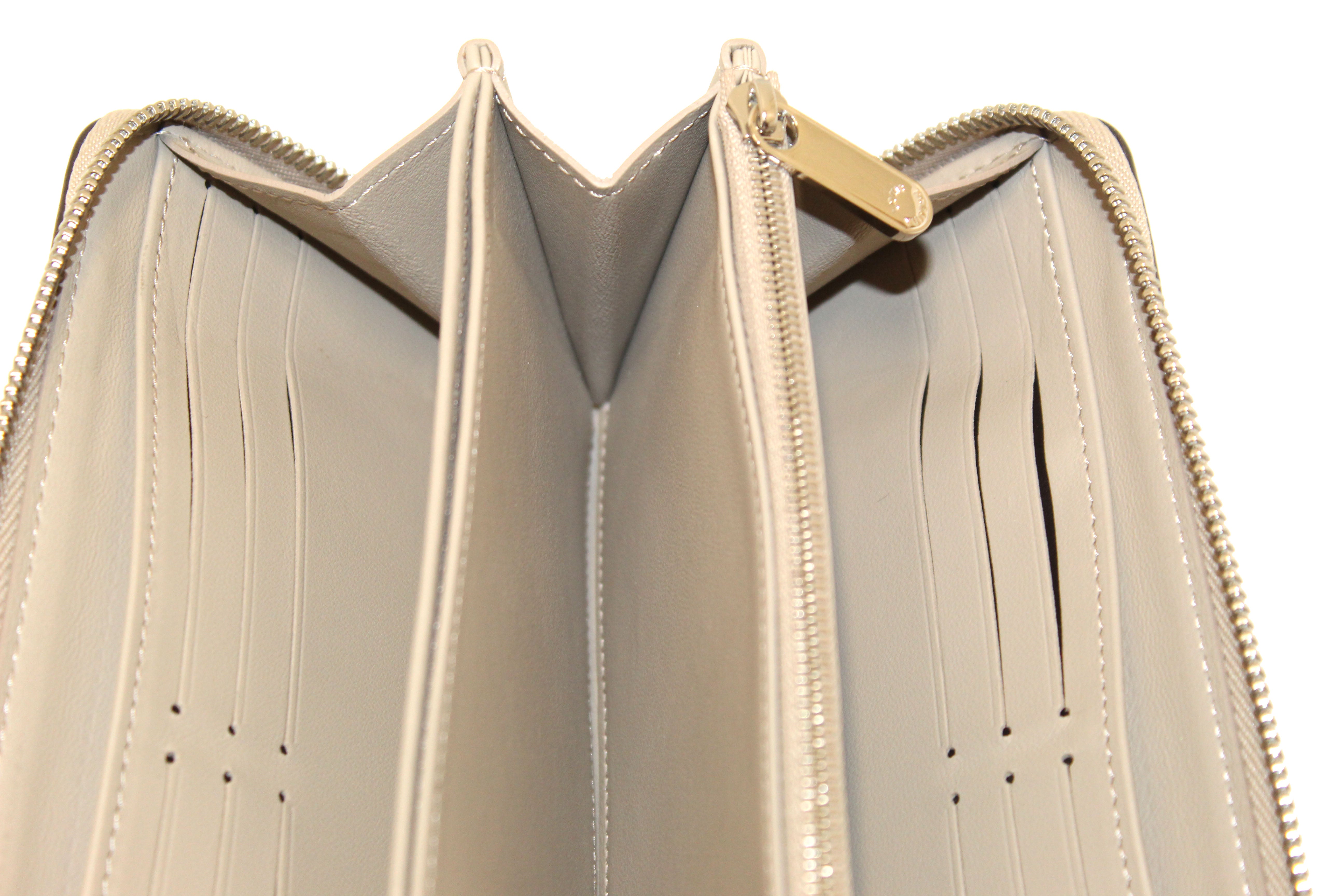 Authentic Louis Vuitton Galet Mahina Leather Zippy Wallet