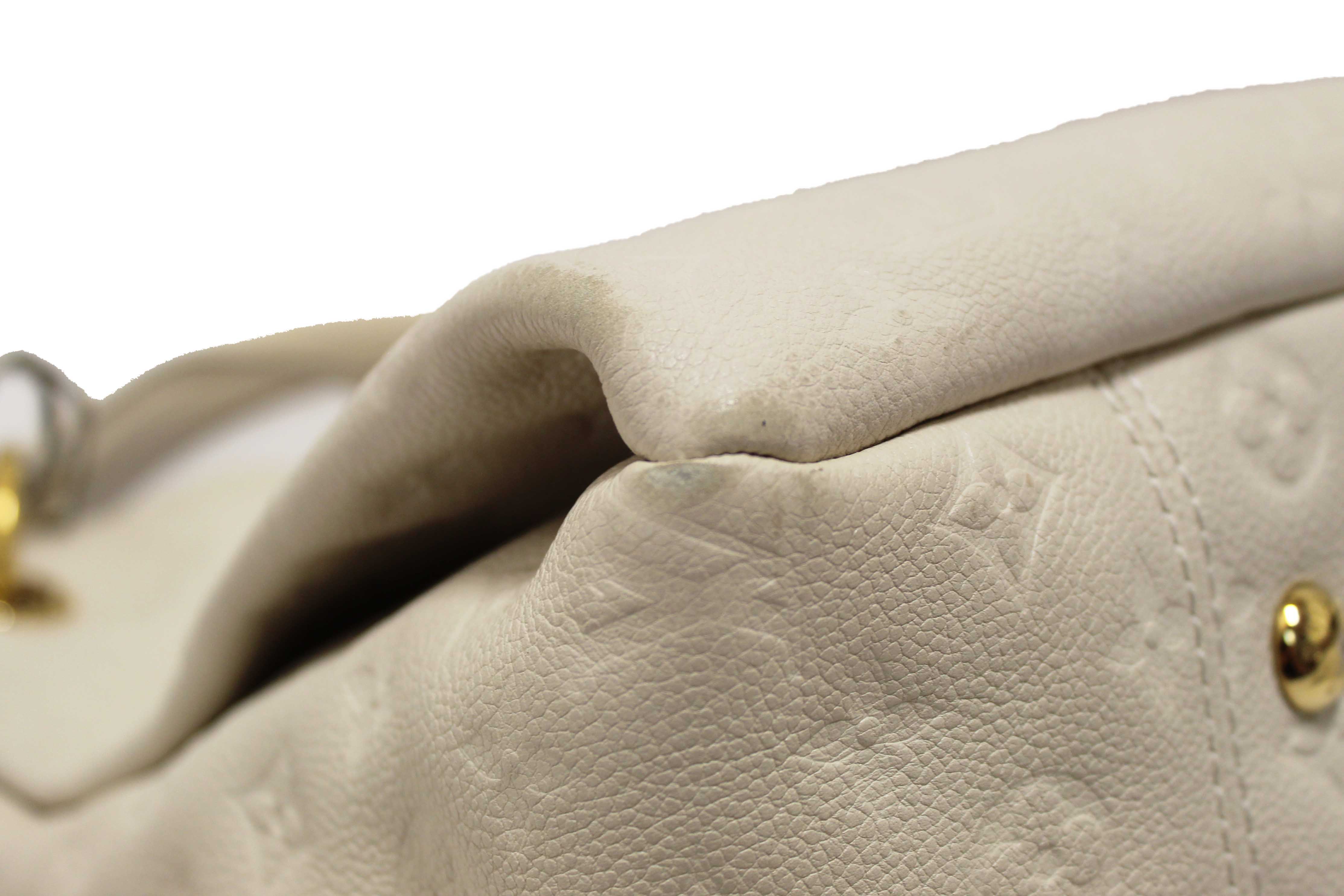 Authentic Louis Vuitton White Monogram Empreinte Leather Artsy MM Hobo Bag