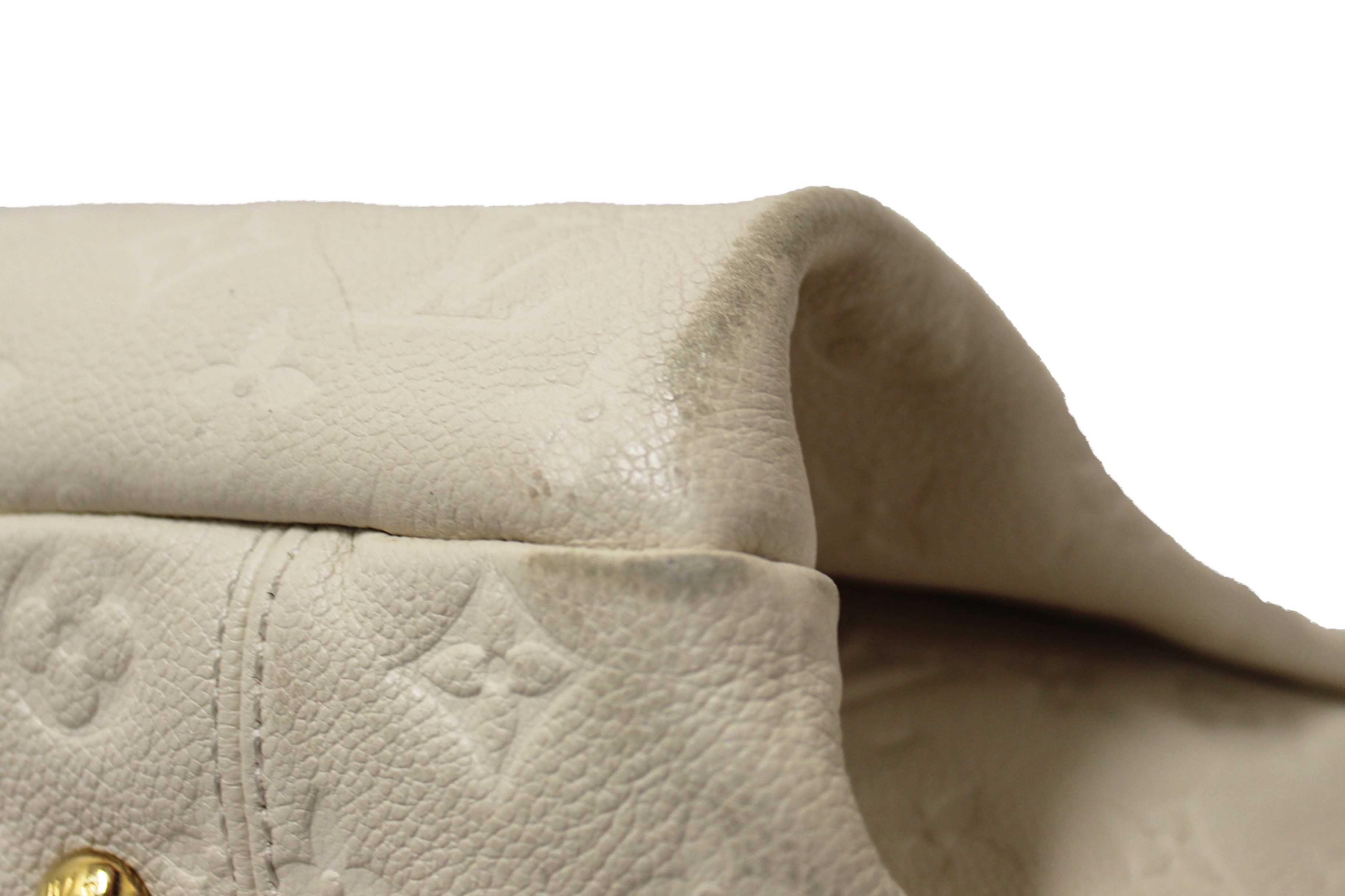 Authentic Louis Vuitton White Monogram Empreinte Leather Artsy MM Hobo Bag