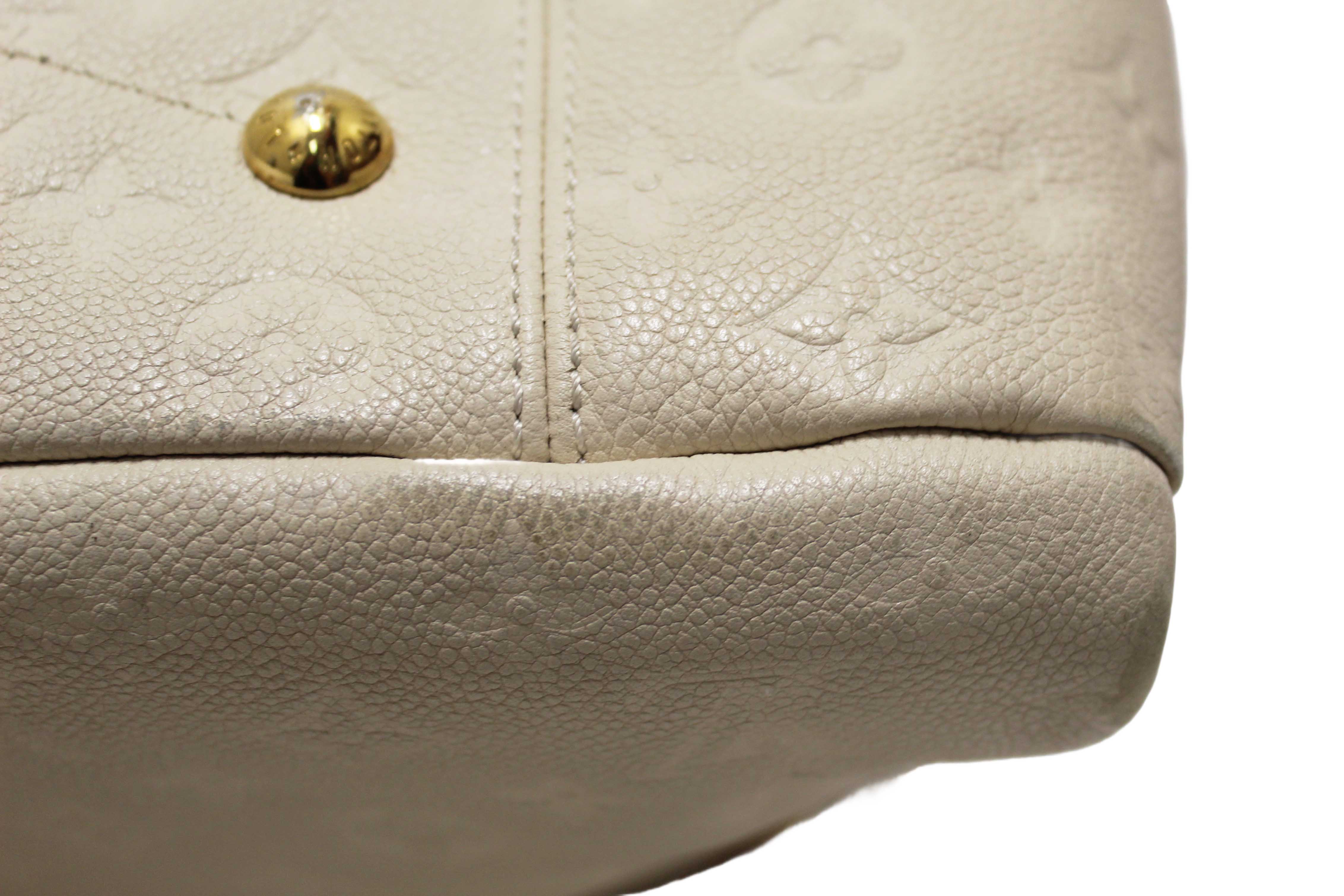 Authentic Louis Vuitton White Monogram Empreinte Leather Artsy MM Hobo Bag