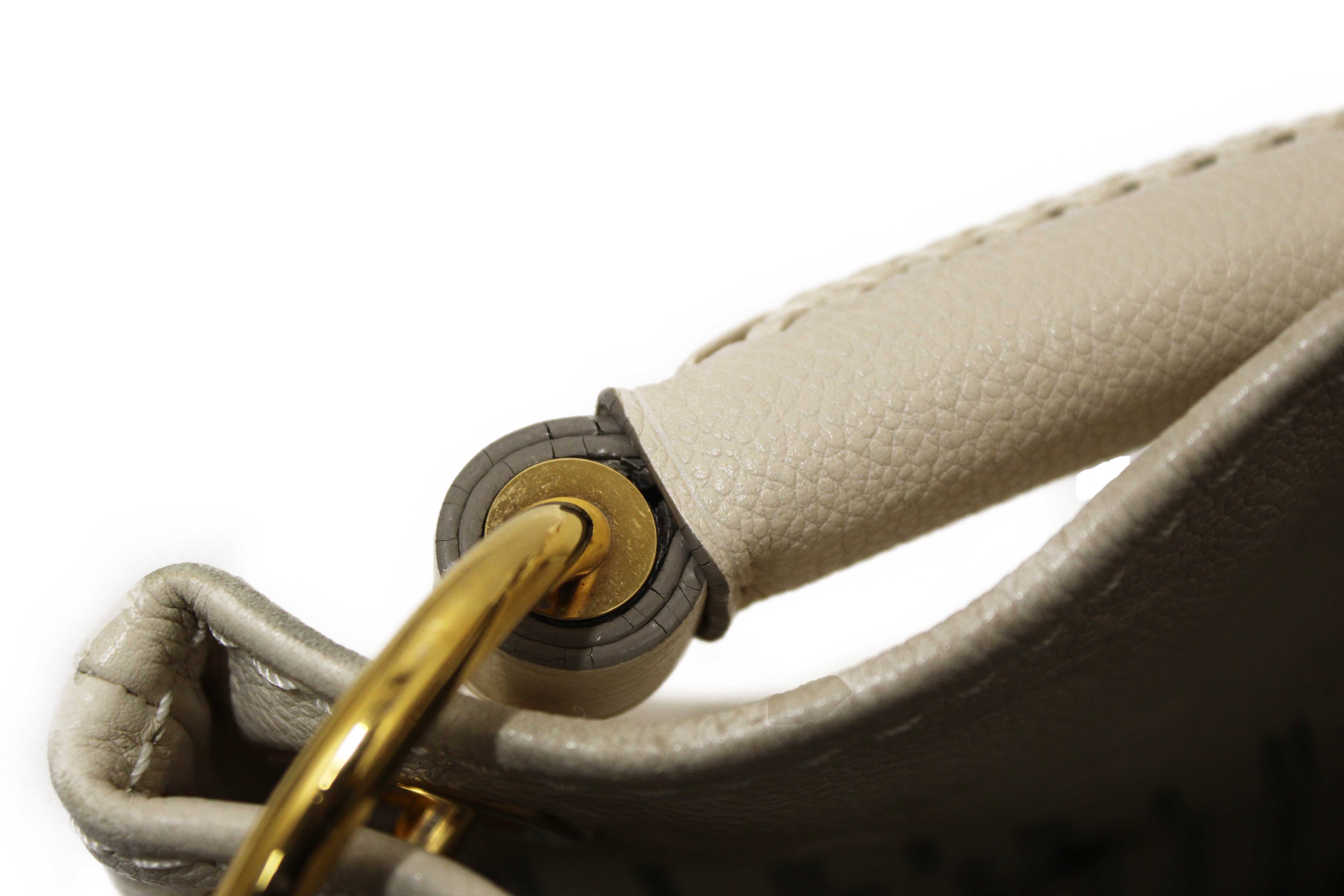 Authentic Louis Vuitton White Monogram Empreinte Leather Artsy MM Hobo Bag