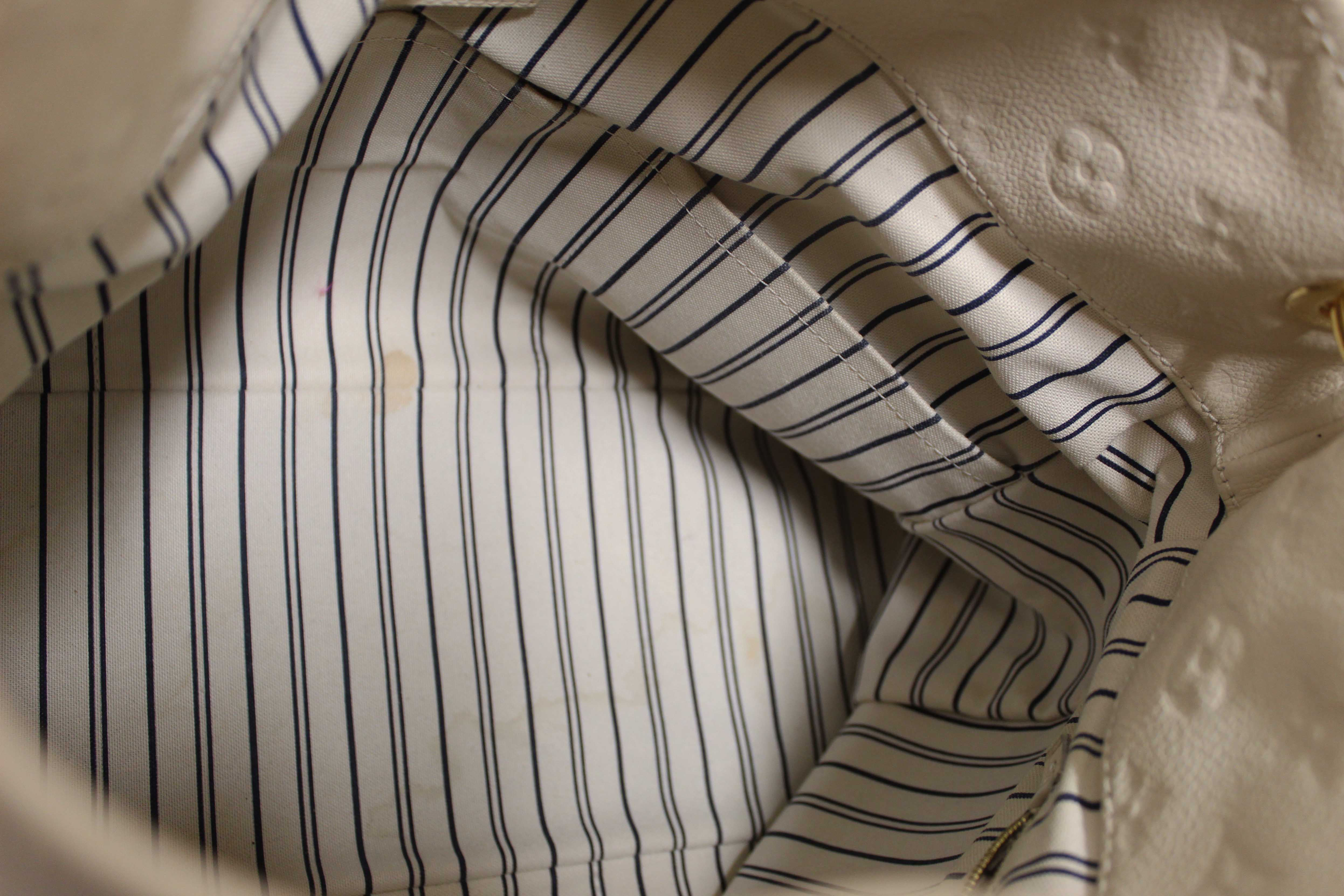 Authentic Louis Vuitton White Monogram Empreinte Leather Artsy MM Hobo Bag