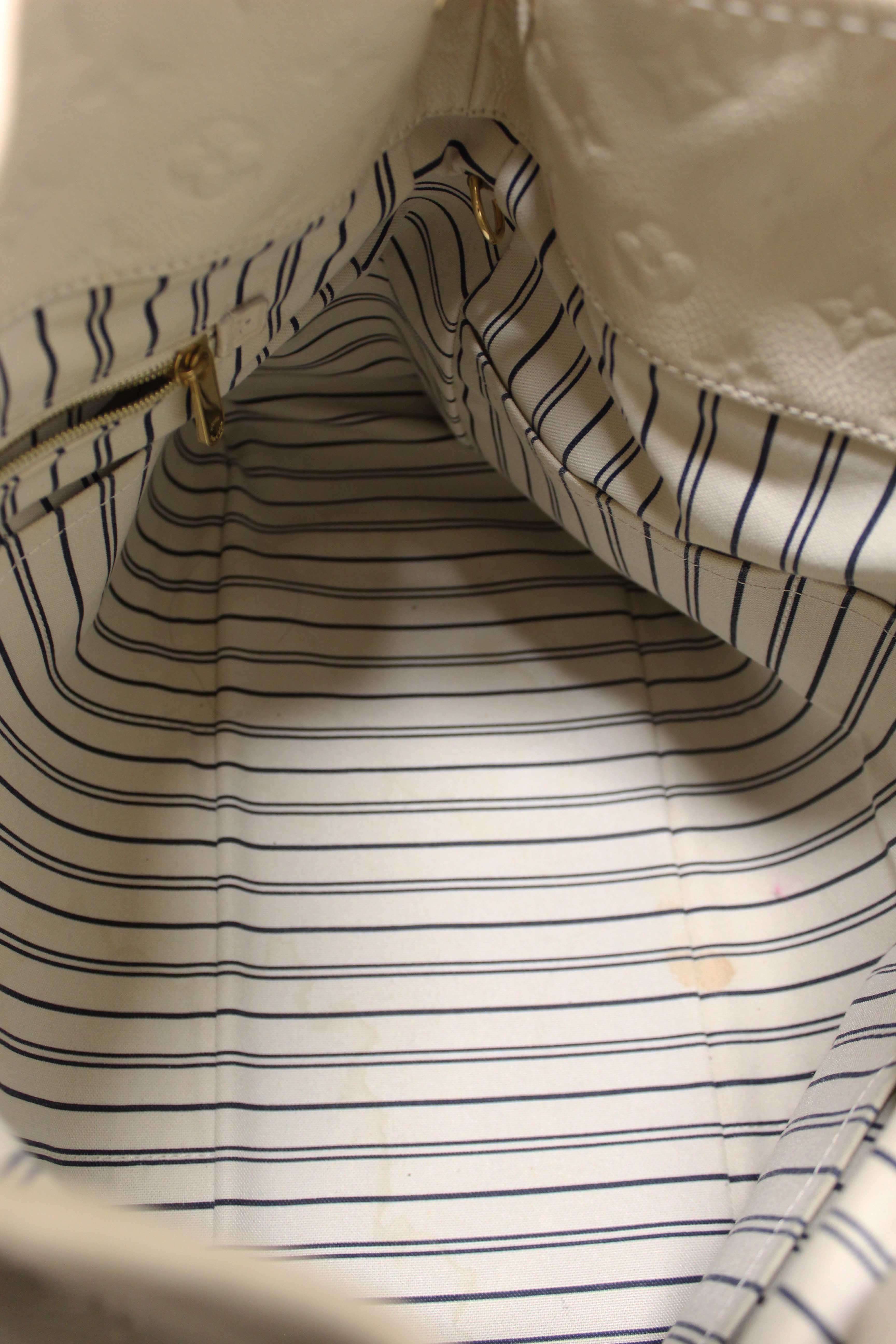 Authentic Louis Vuitton White Monogram Empreinte Leather Artsy MM Hobo Bag