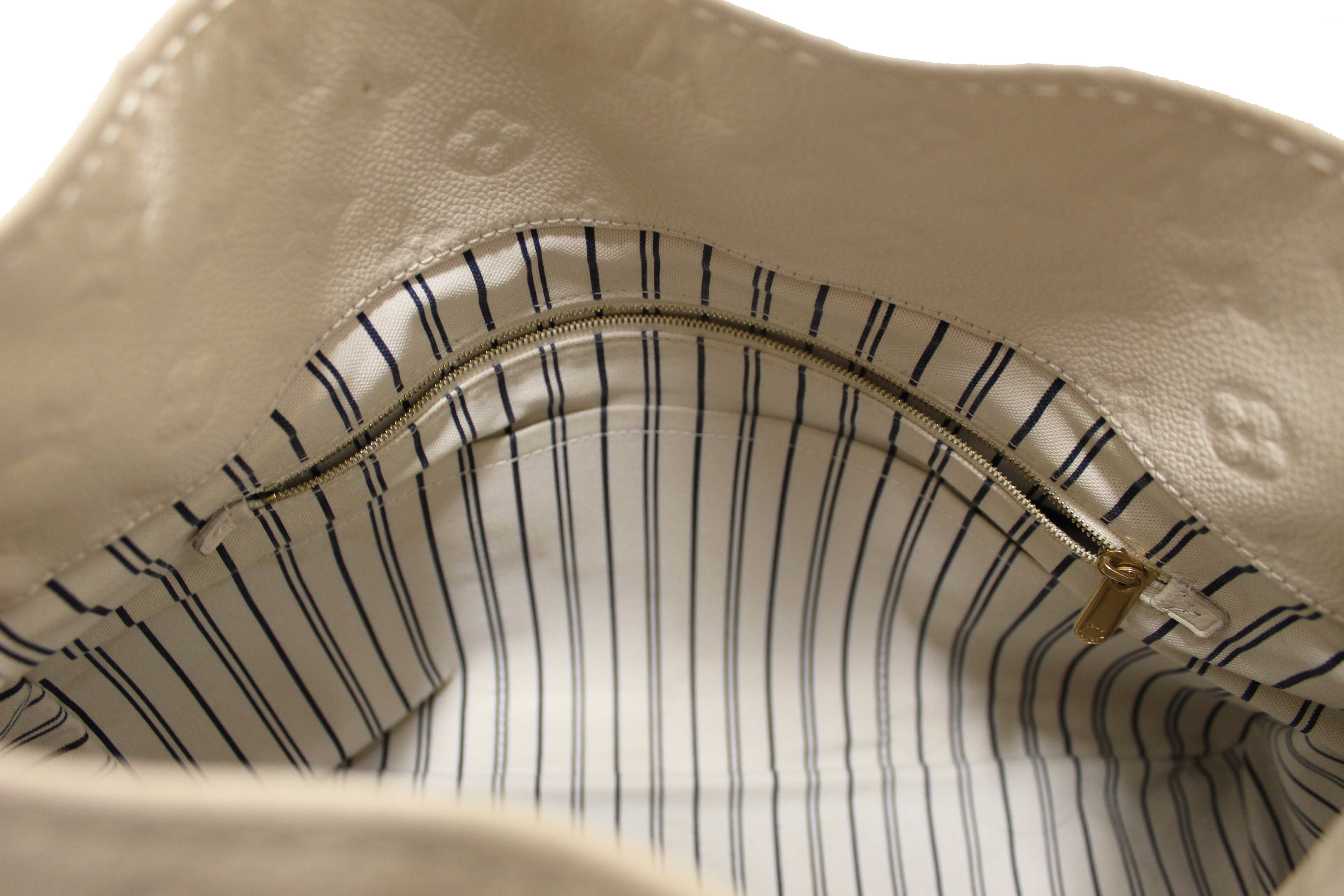 Authentic Louis Vuitton White Monogram Empreinte Leather Artsy MM Hobo Bag