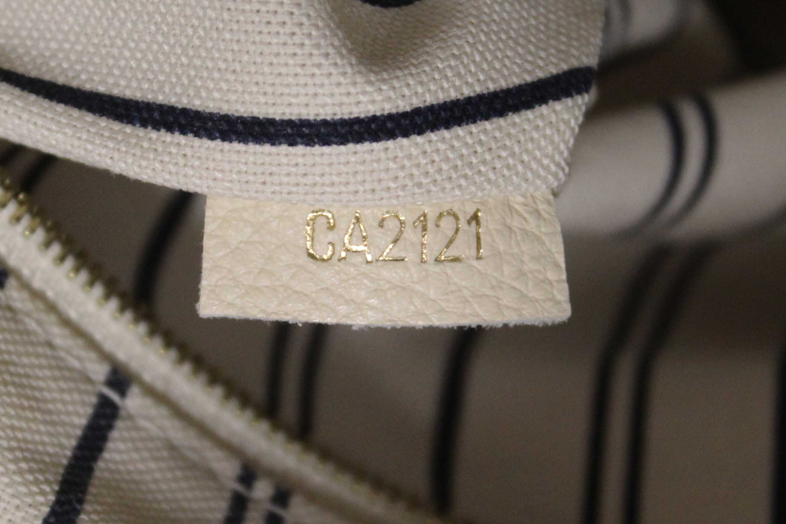 Authentic Louis Vuitton White Monogram Empreinte Leather Artsy MM Hobo Bag