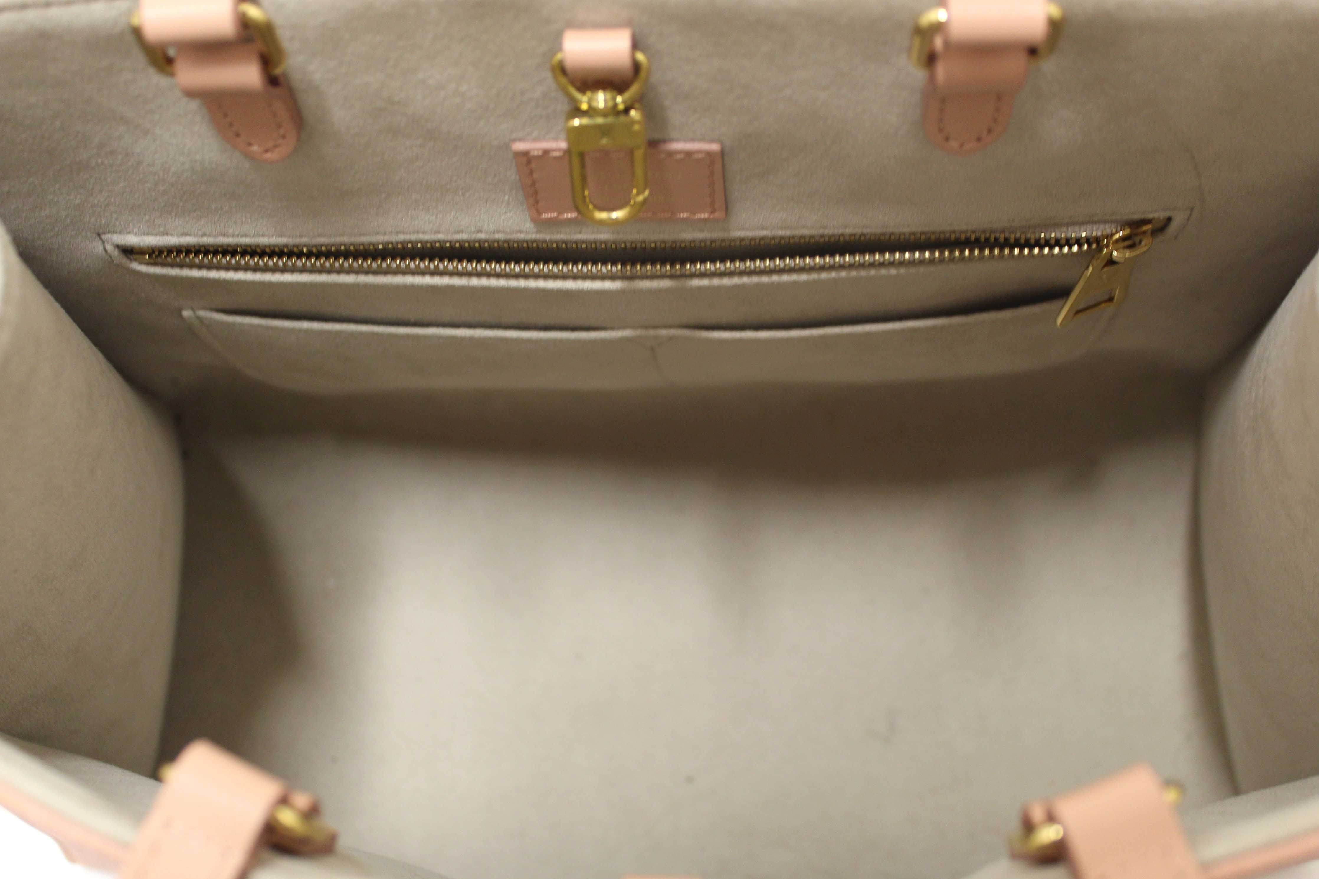 Authentic Louis Vuitton Pink Monogram Empreinte Cowhide Leather OnTheGo MM Bag