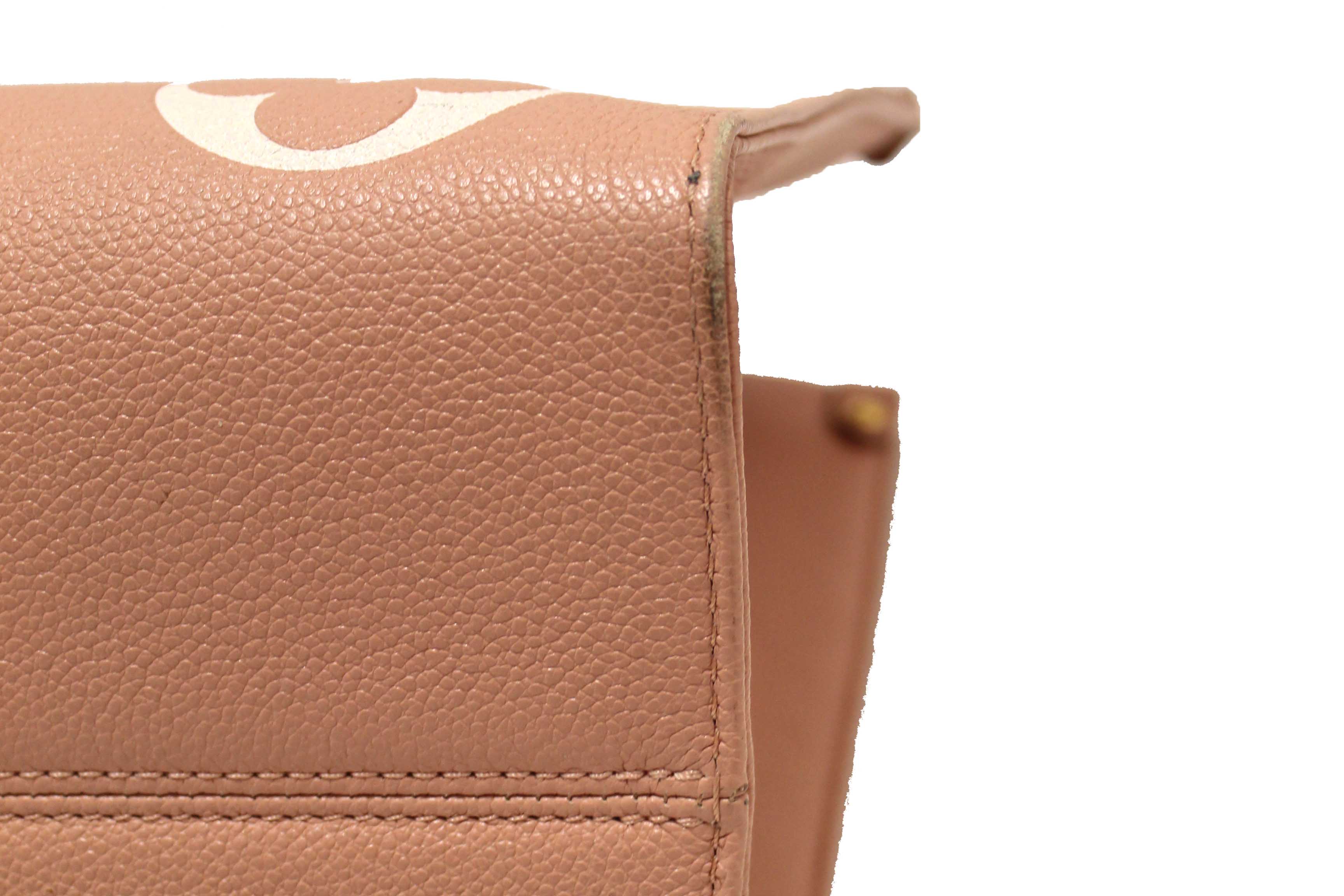 Authentic Louis Vuitton Pink Monogram Empreinte Cowhide Leather OnTheGo MM Bag