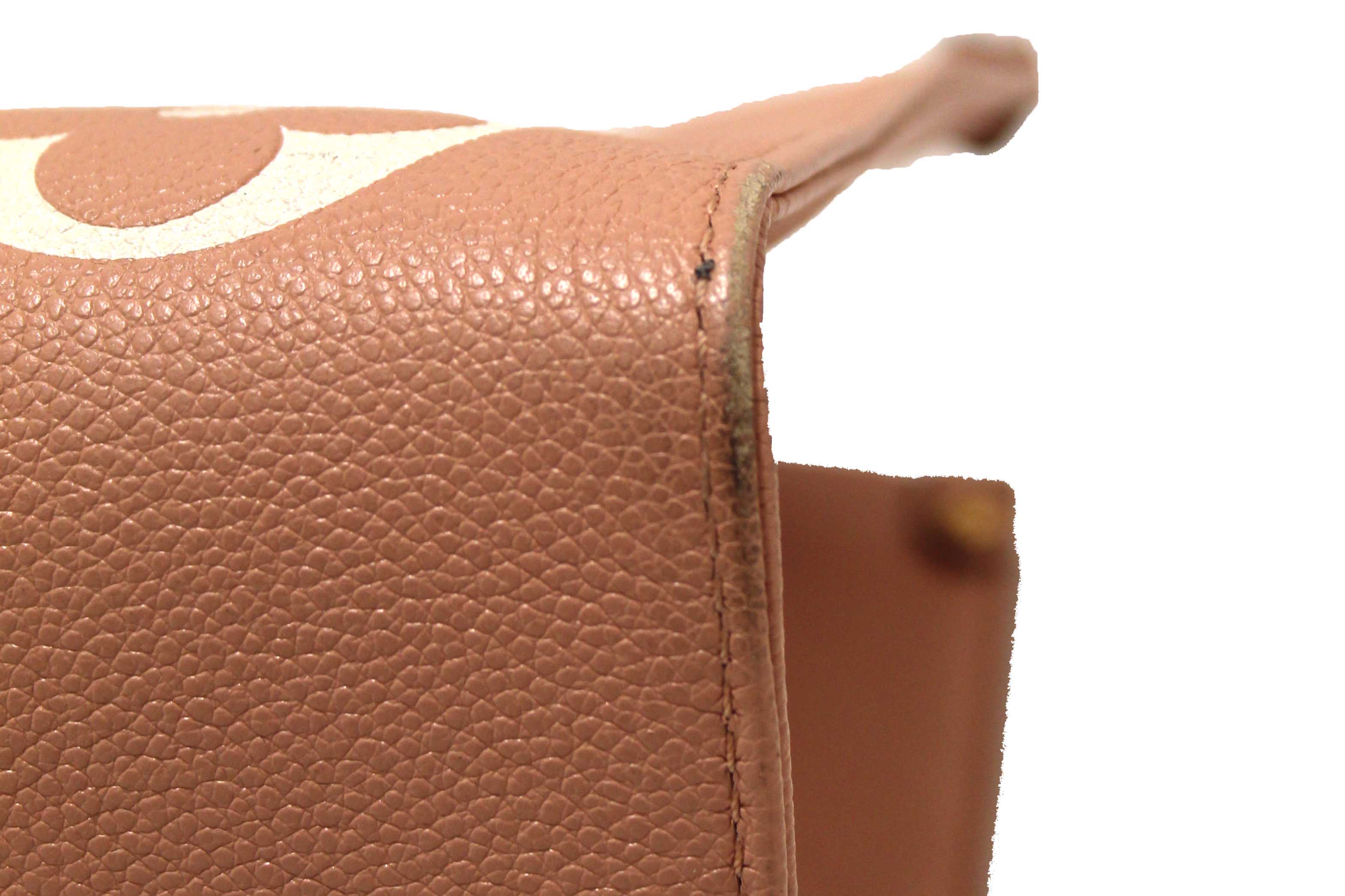 Authentic Louis Vuitton Pink Monogram Empreinte Cowhide Leather OnTheGo MM Bag