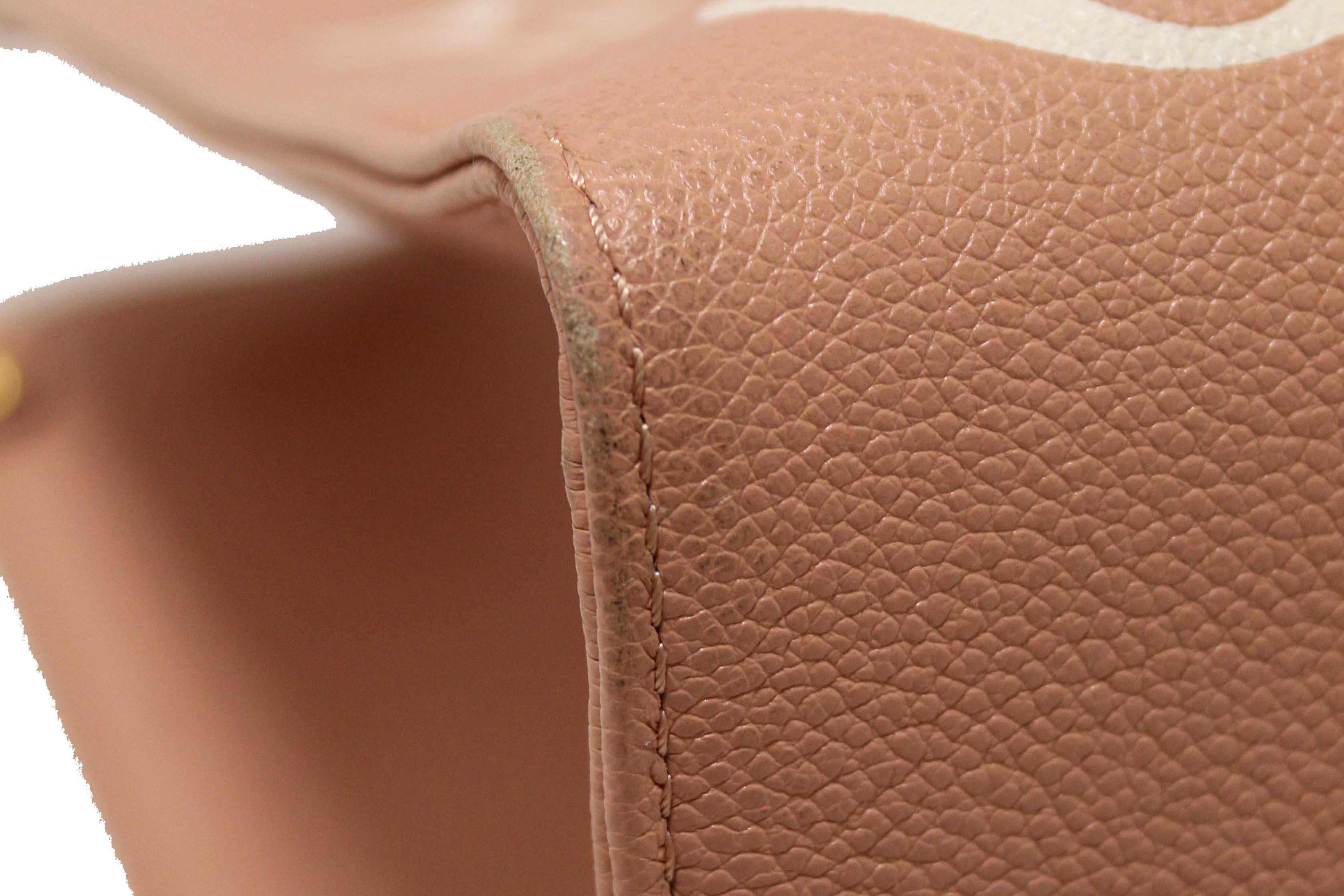 Authentic Louis Vuitton Pink Monogram Empreinte Cowhide Leather OnTheGo MM Bag