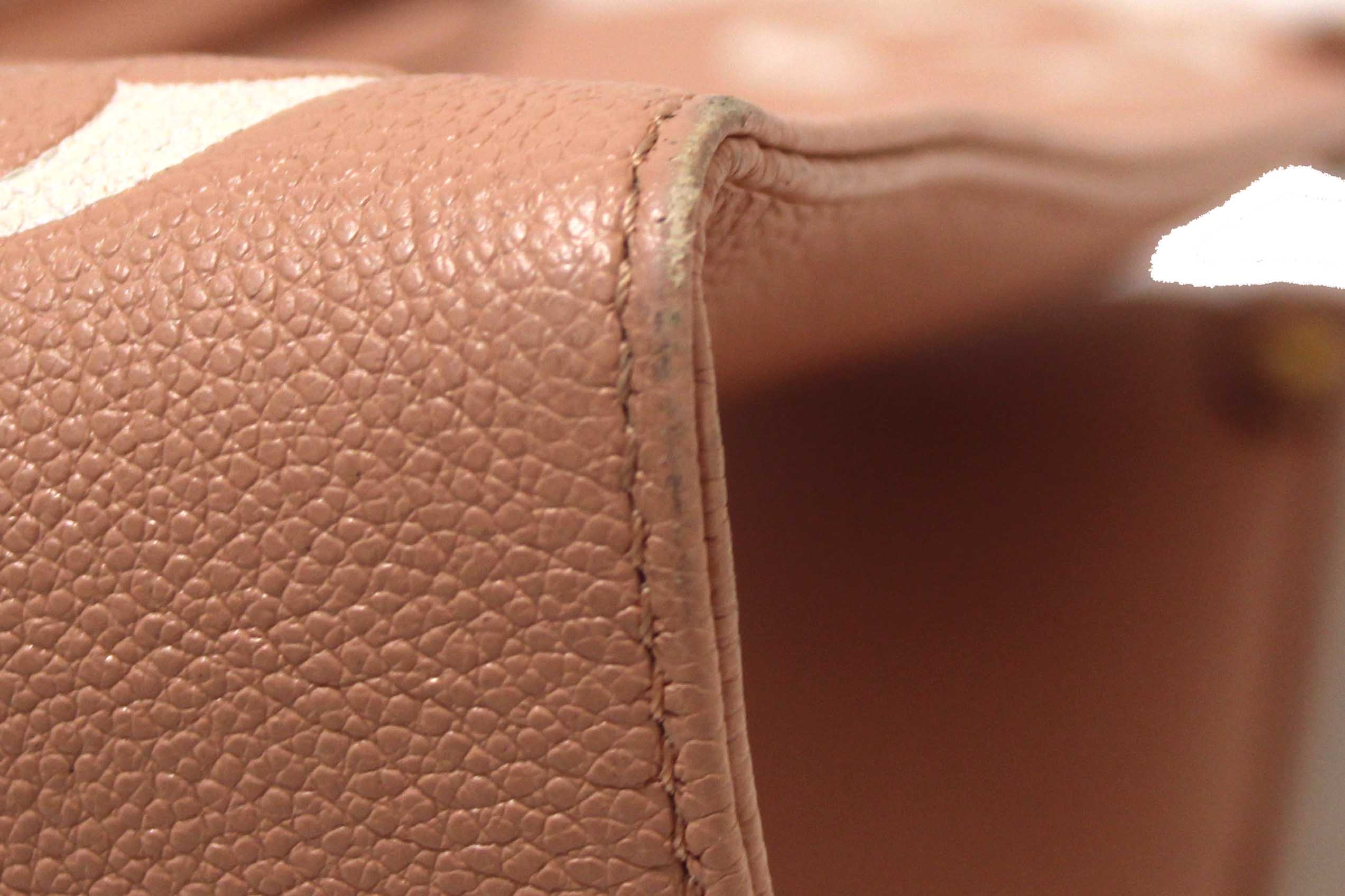 Authentic Louis Vuitton Pink Monogram Empreinte Cowhide Leather OnTheGo MM Bag