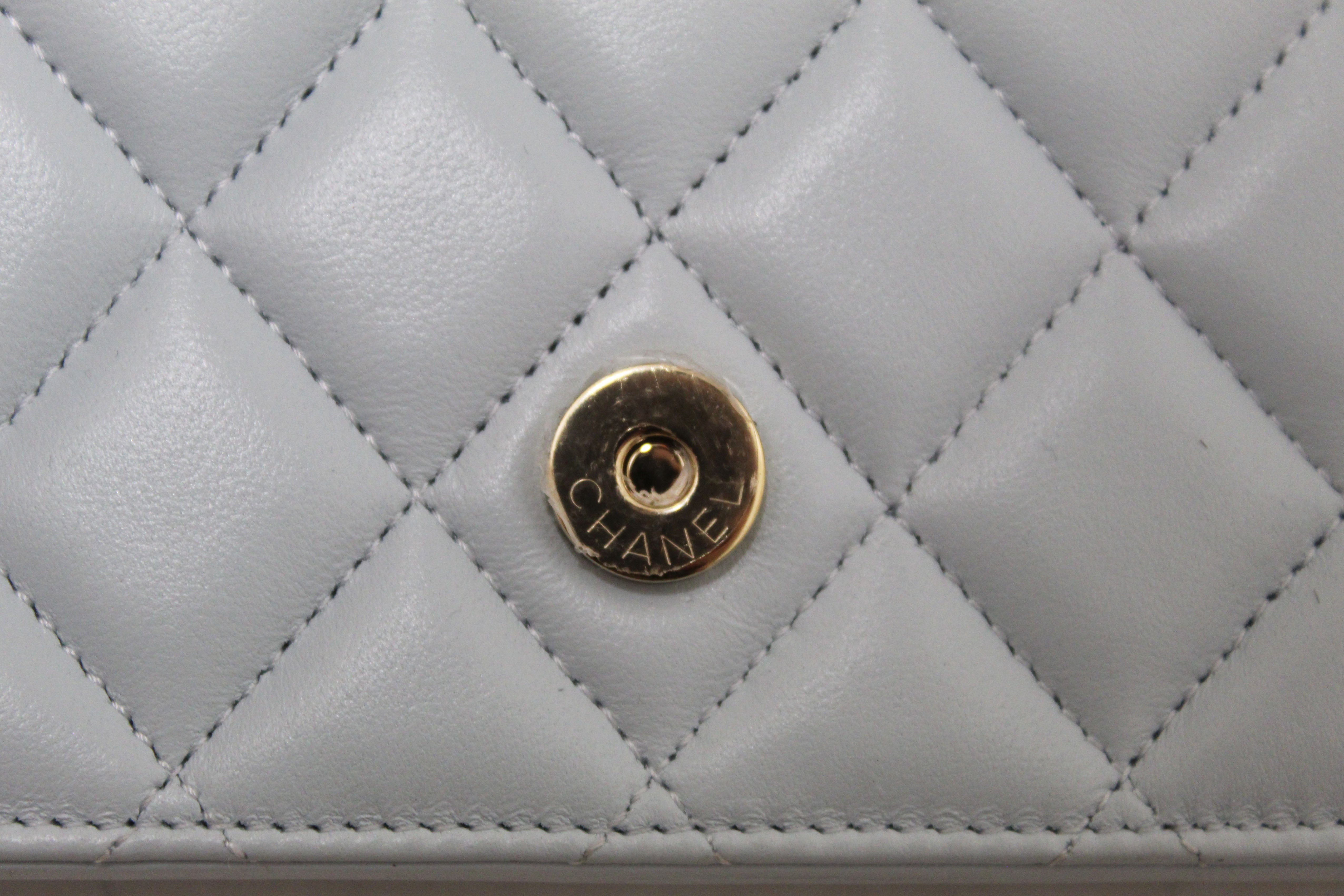 Authentic Chanel Light Blue Quilted Lambskin Leather Flap Phone Holder with Chain Crossbody Bag