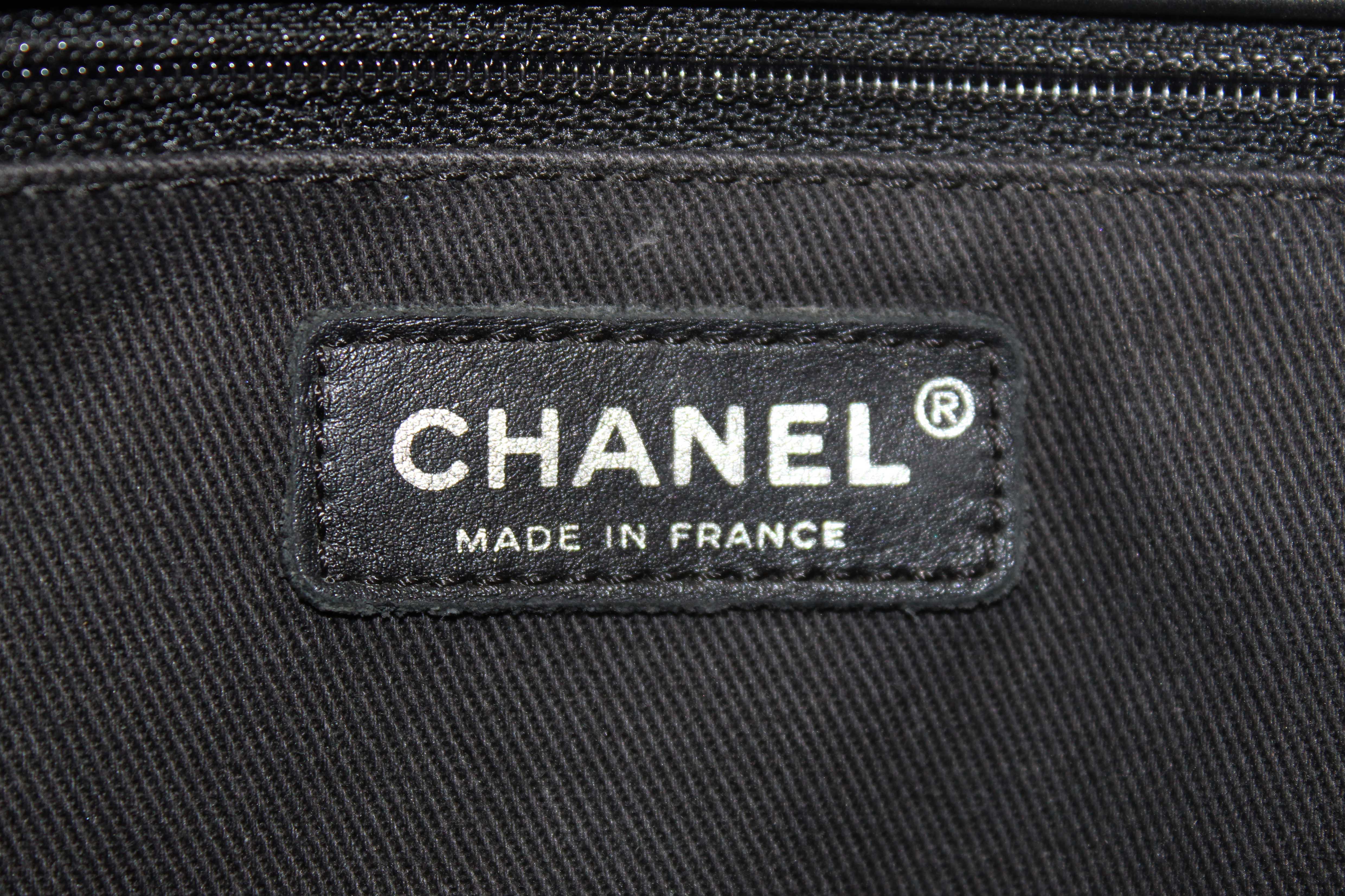 Authentic Chanel Black Quilted Calfskin Leather Expandable Ligne Flap Bag