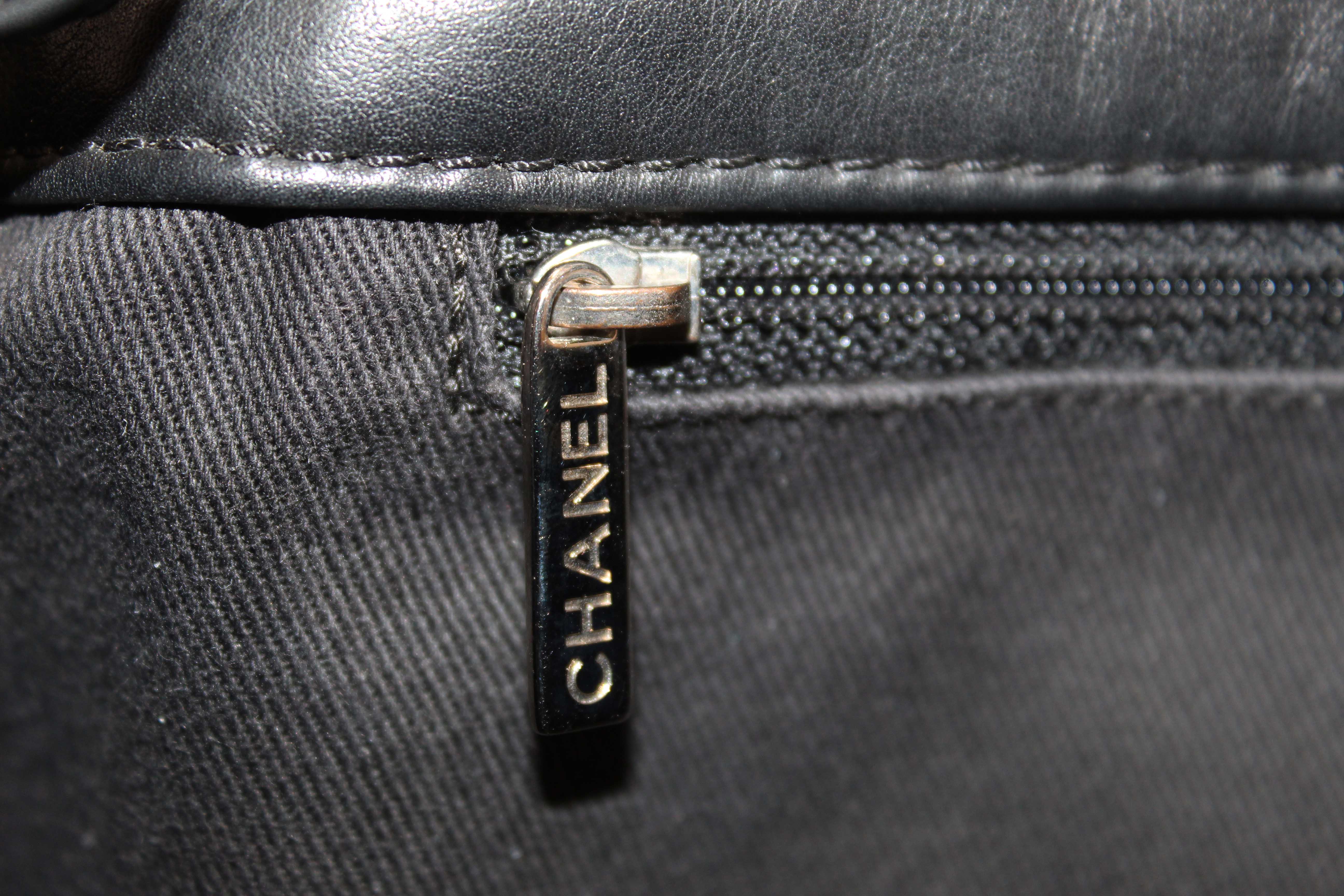 Authentic Chanel Black Quilted Calfskin Leather Expandable Ligne Flap Bag