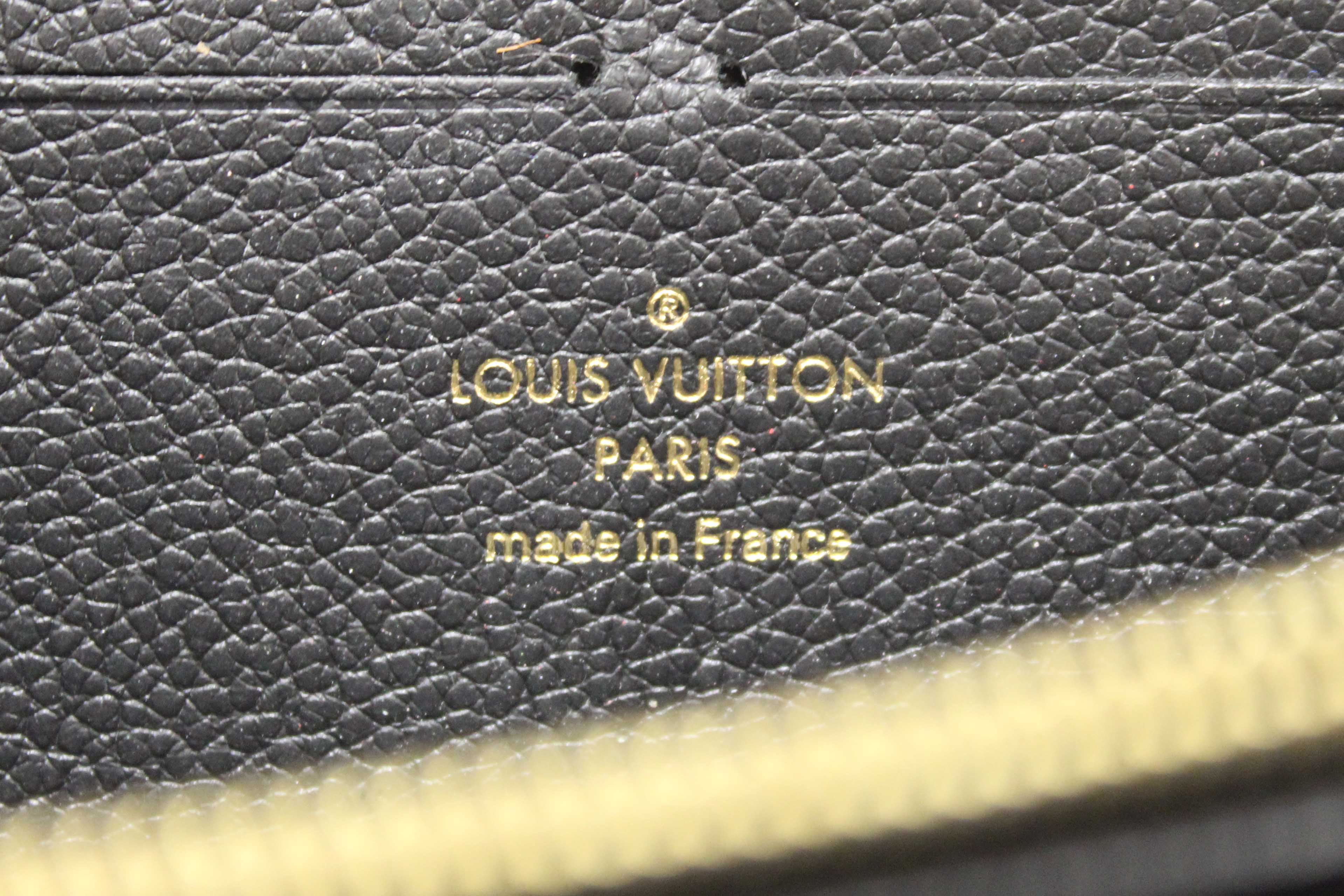 Authentic Louis Vuitton Black Empreinte Leather Clemence Wallet