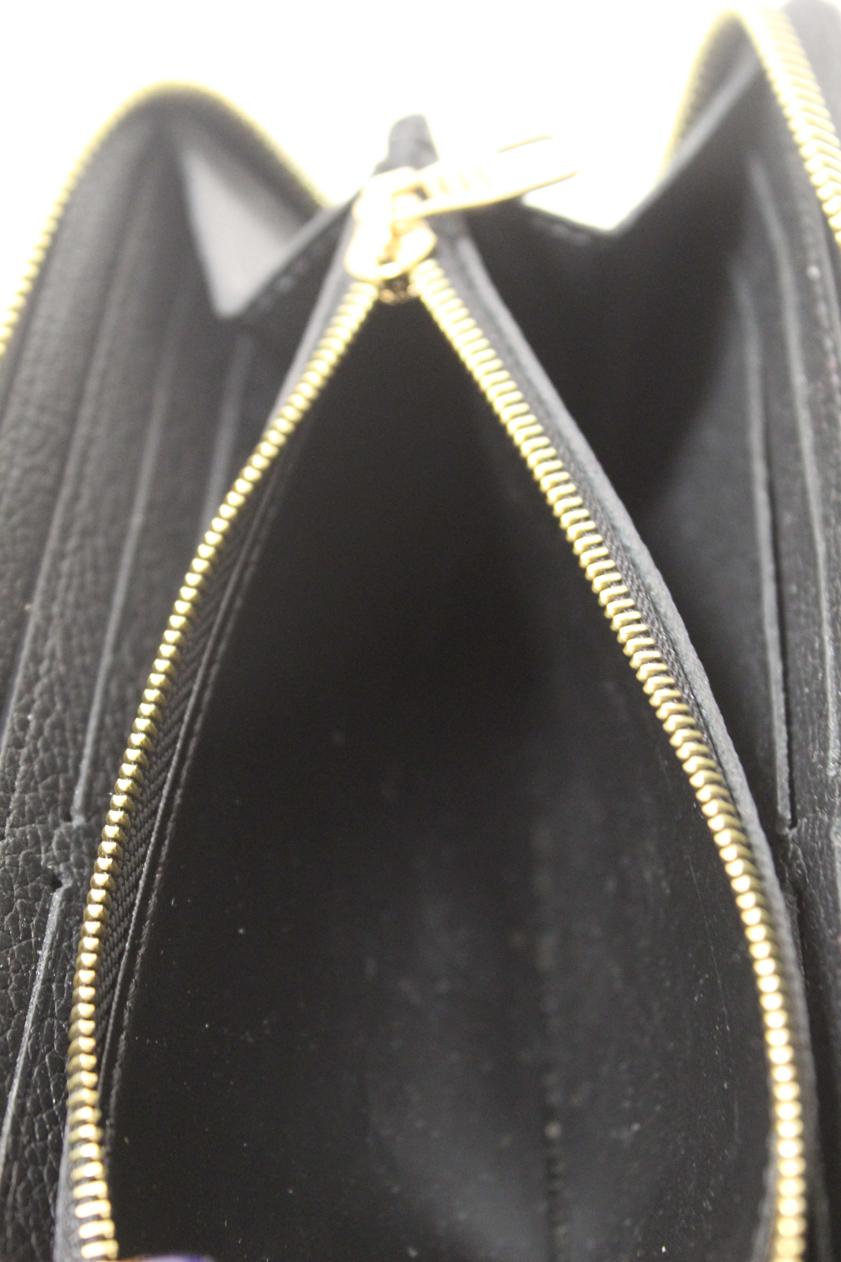 Authentic Louis Vuitton Black Empreinte Leather Clemence Wallet