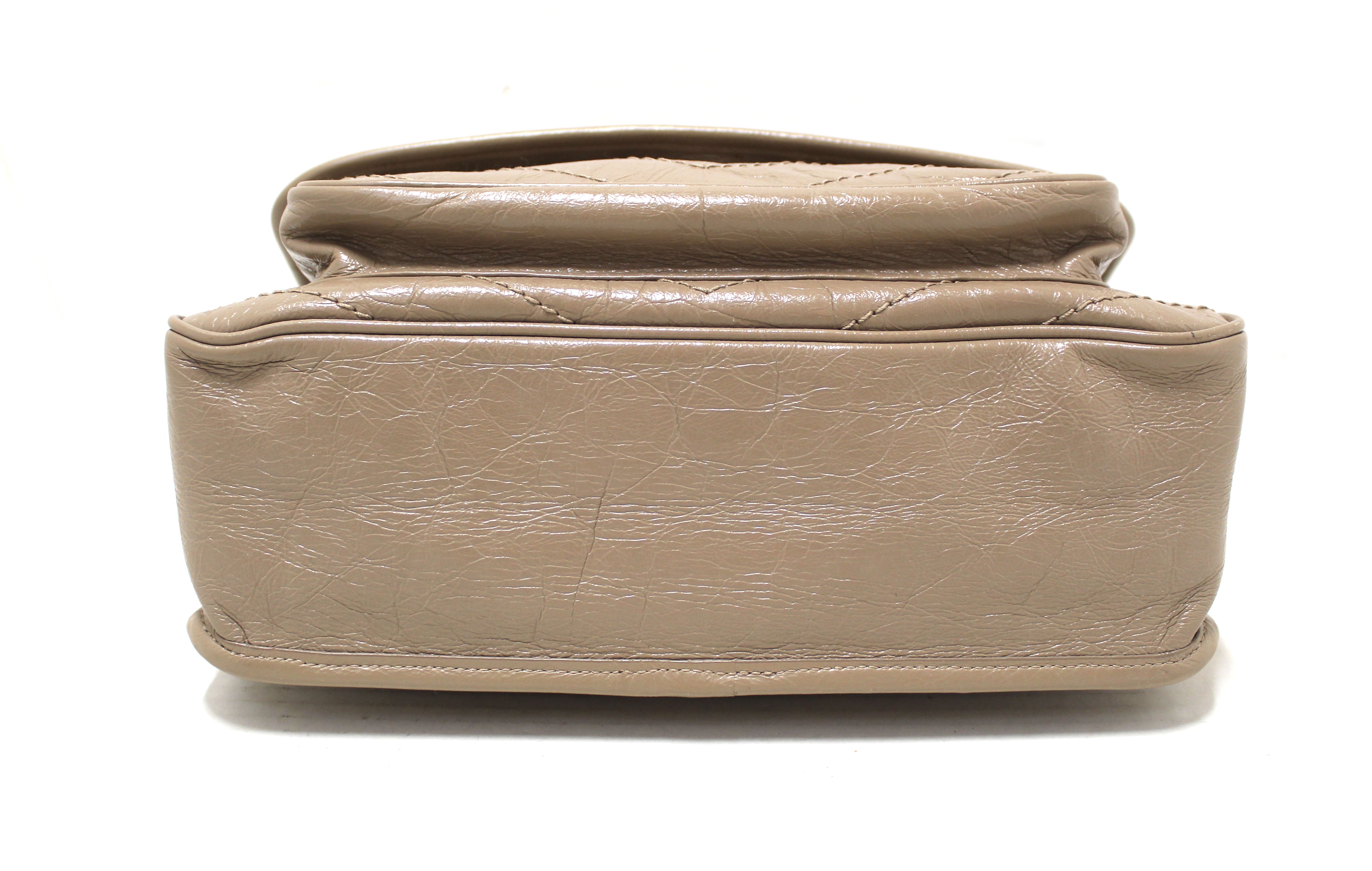 Vintage Yves Saint Laurent brown leather handbag with YSL marks