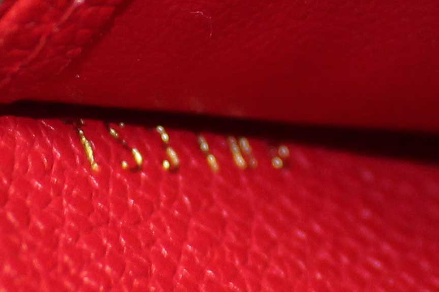 Authentic Louis Vuitton Red Monogram Empreinte Leather Zippy Coin Purse