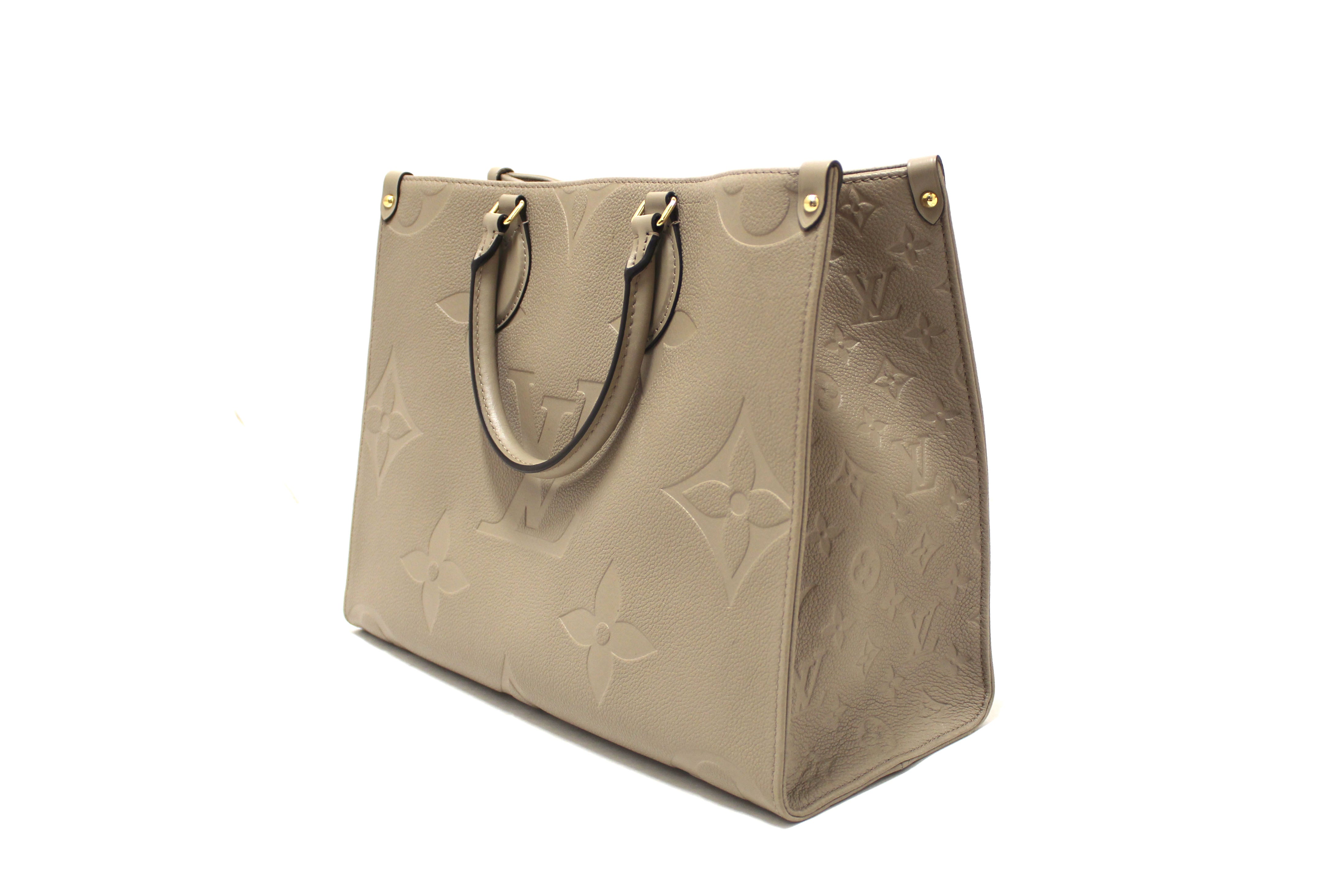 Authentic Louis Vuitton Turtledove Monogram Empreinte Leather OnTheGo MM Tote Bag