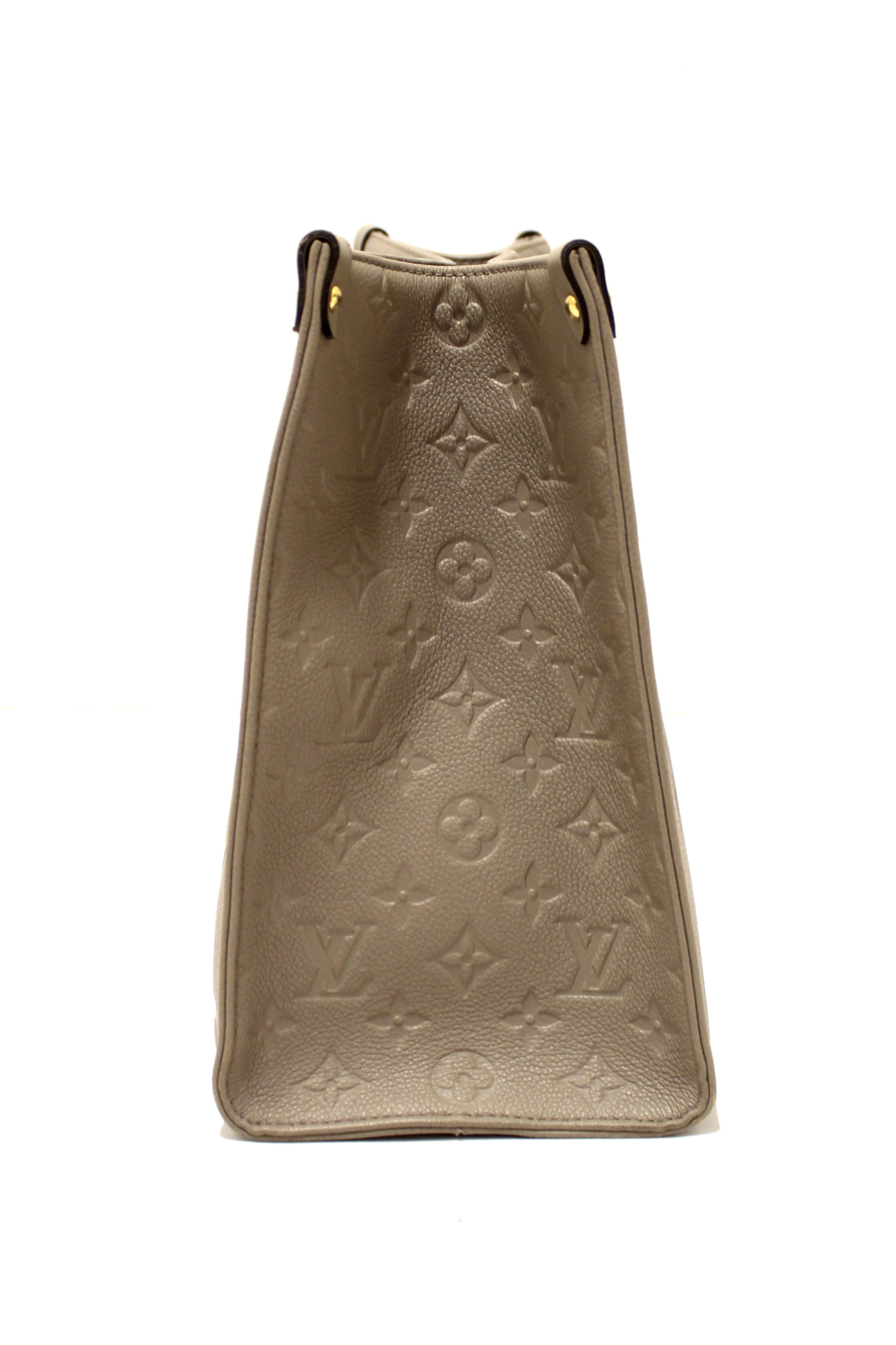 Authentic Louis Vuitton Turtledove Monogram Empreinte Leather OnTheGo MM Tote Bag