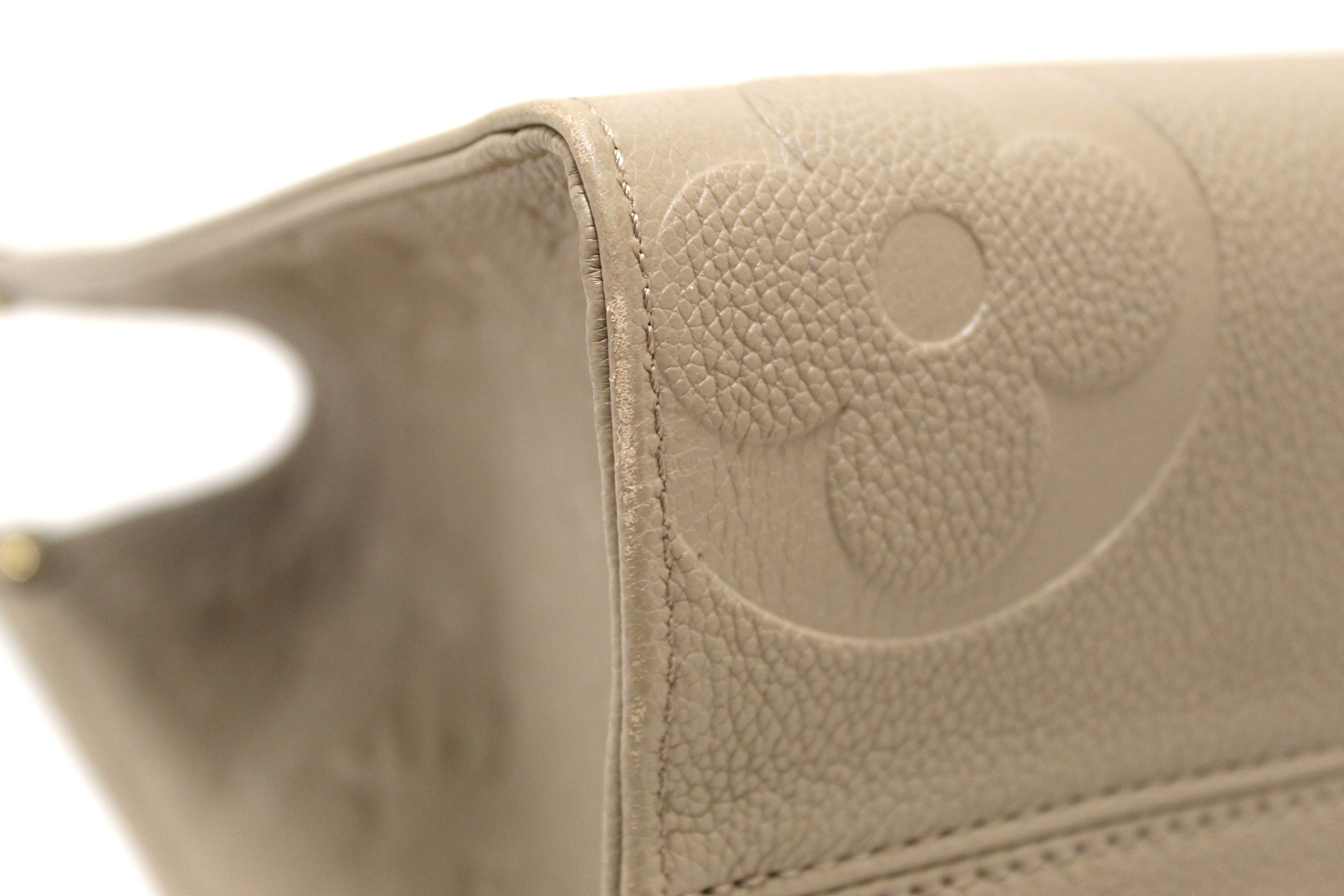 Authentic Louis Vuitton Turtledove Monogram Empreinte Leather OnTheGo MM Tote Bag