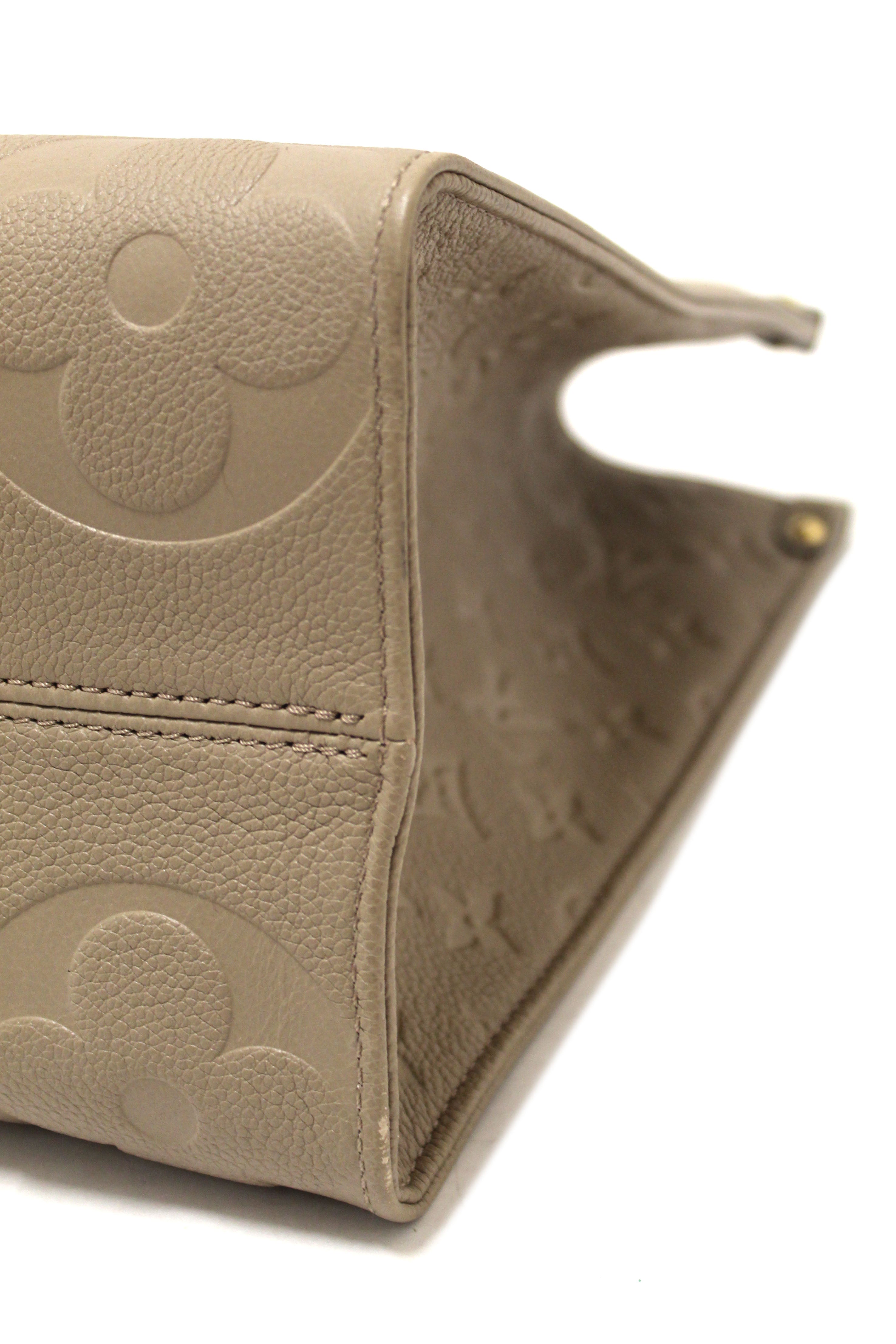 Authentic Louis Vuitton Turtledove Monogram Empreinte Leather OnTheGo MM Tote Bag