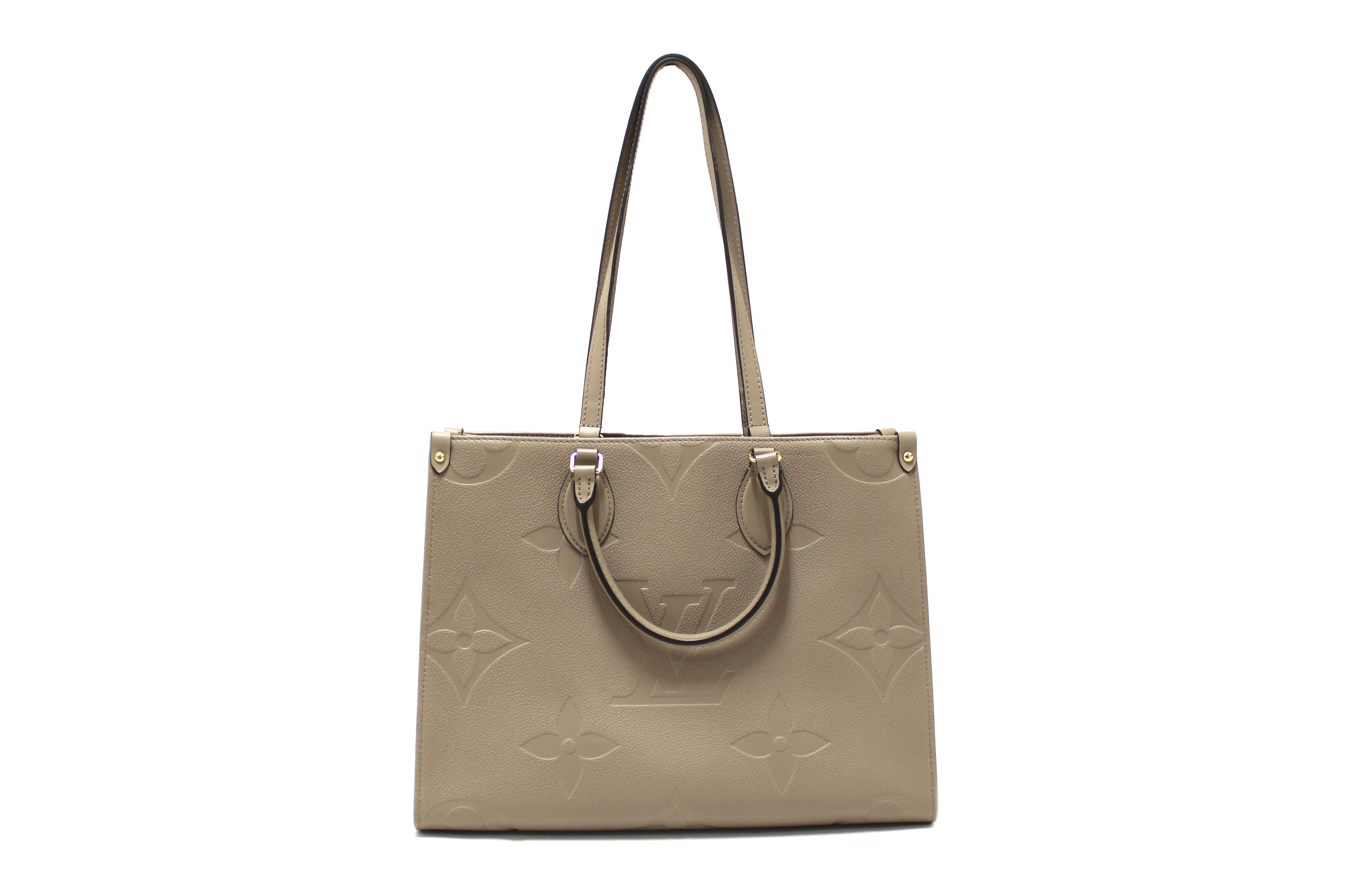 Authentic Louis Vuitton Turtledove Monogram Empreinte Leather OnTheGo MM Tote Bag