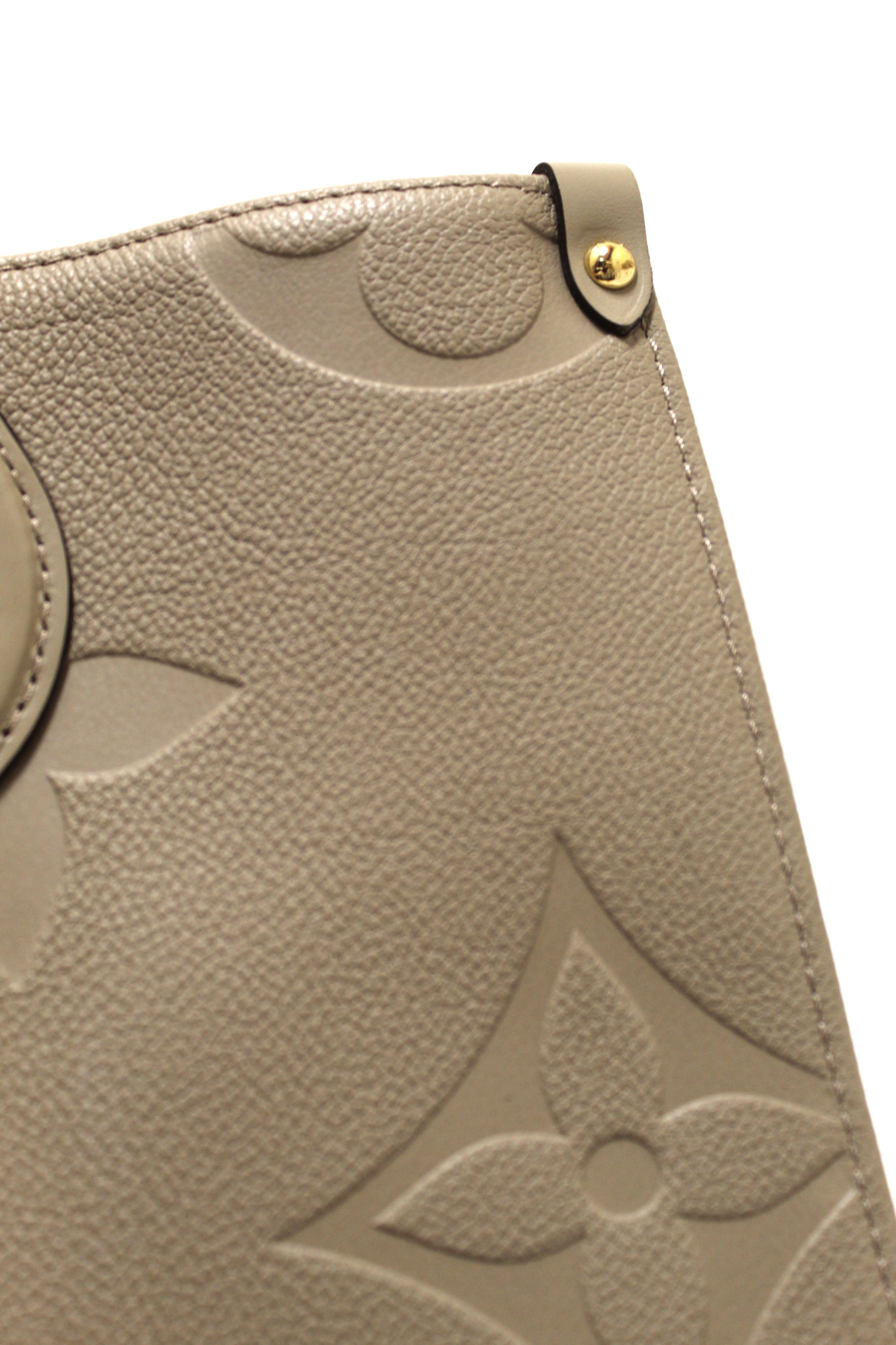 Authentic Louis Vuitton Turtledove Monogram Empreinte Leather OnTheGo MM Tote Bag