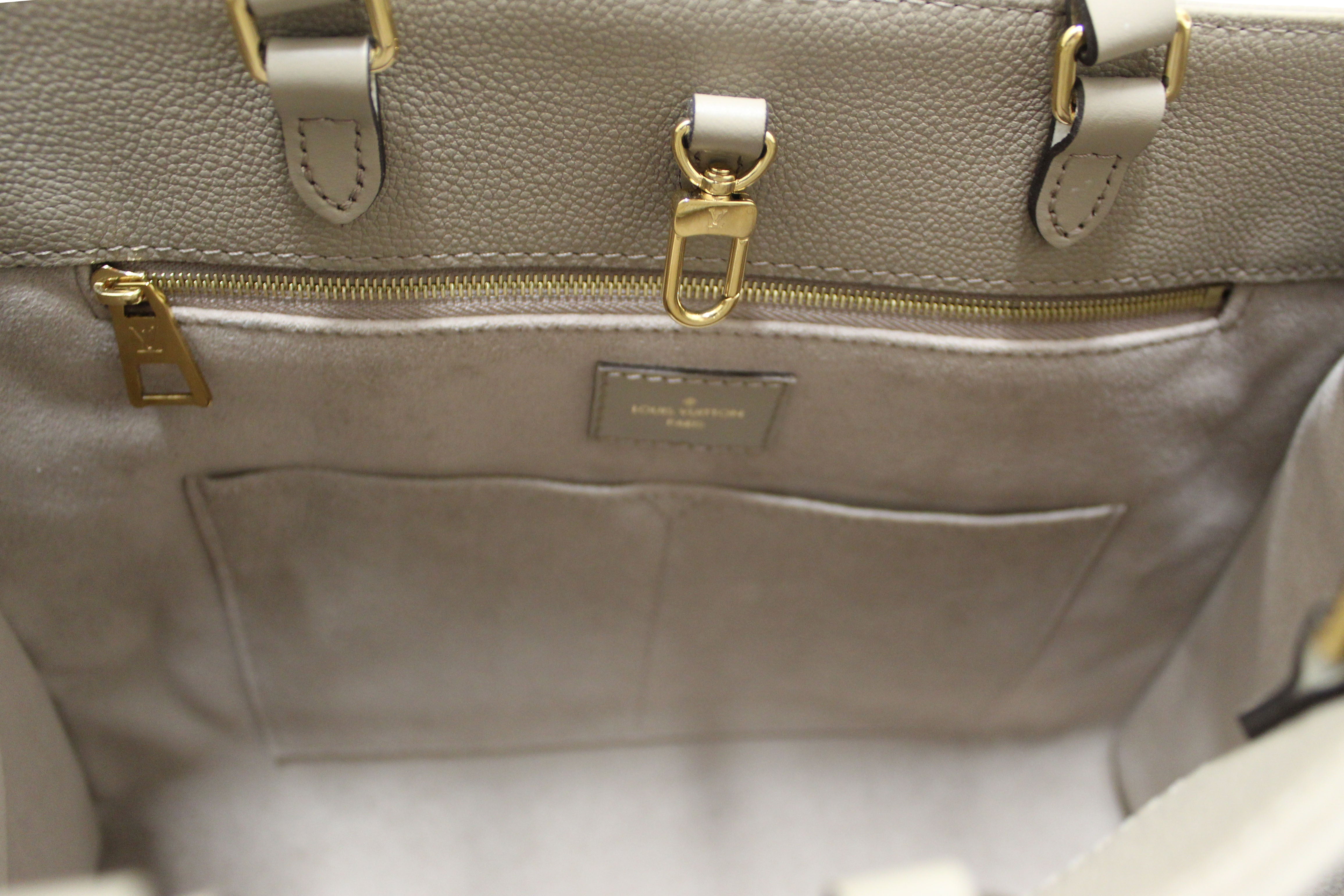 Authentic Louis Vuitton Turtledove Monogram Empreinte Leather OnTheGo MM Tote Bag
