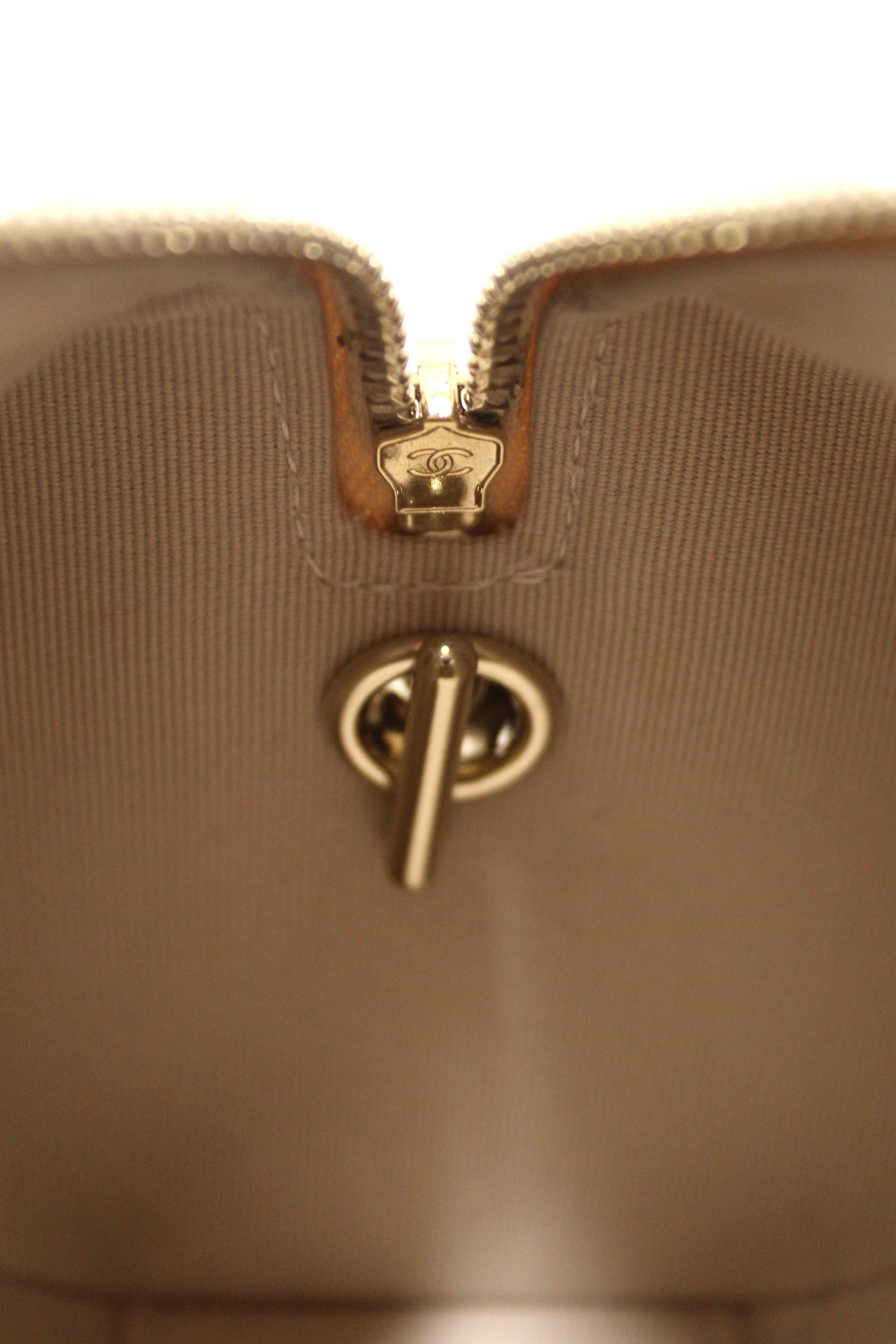 Authentic Chanel Beige Quilted Caviar Leather Mini Bowling with Chain Bag