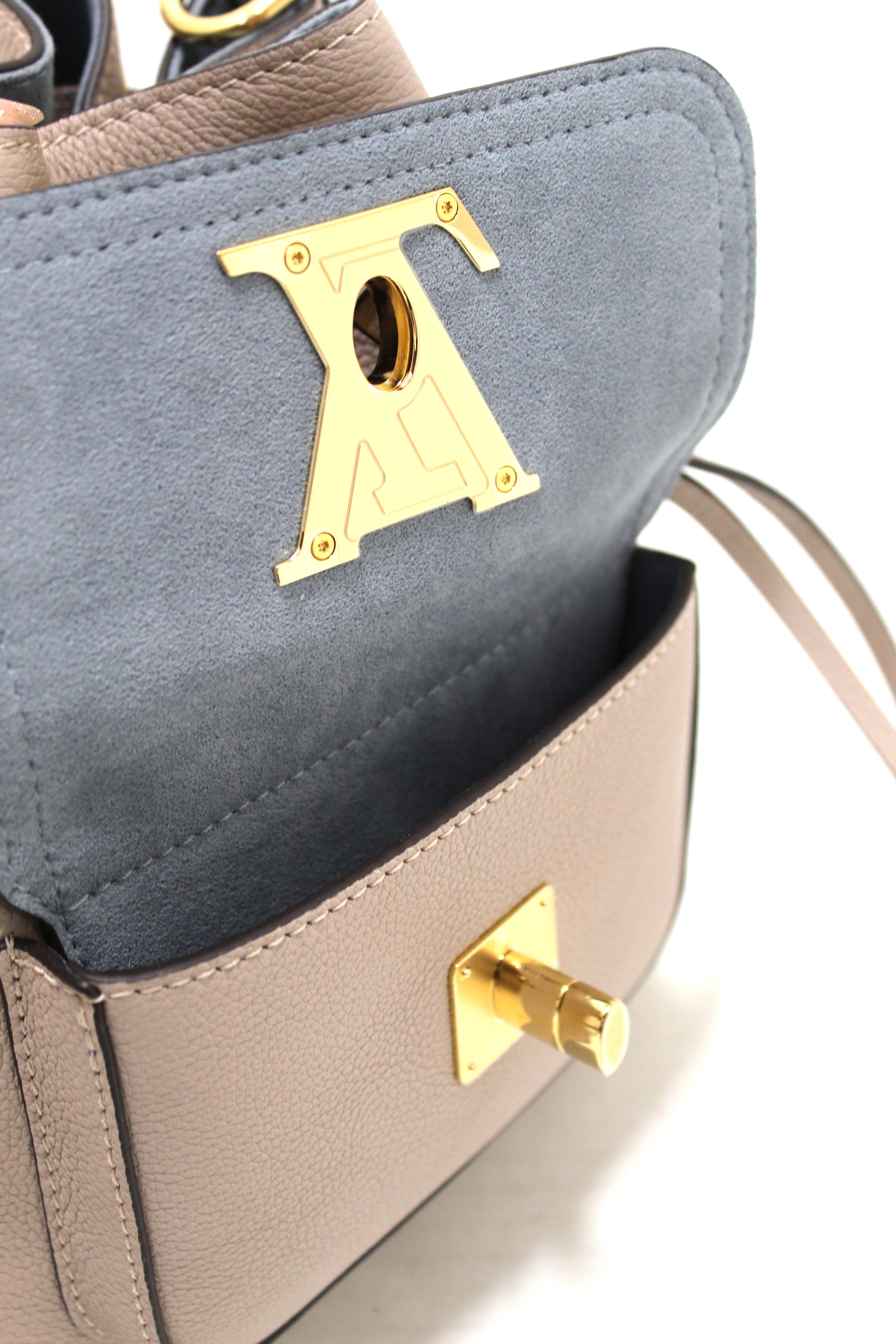 Authentic Louis Vuitton Beige Grained Calf Leather Lockme Bucket Bag
