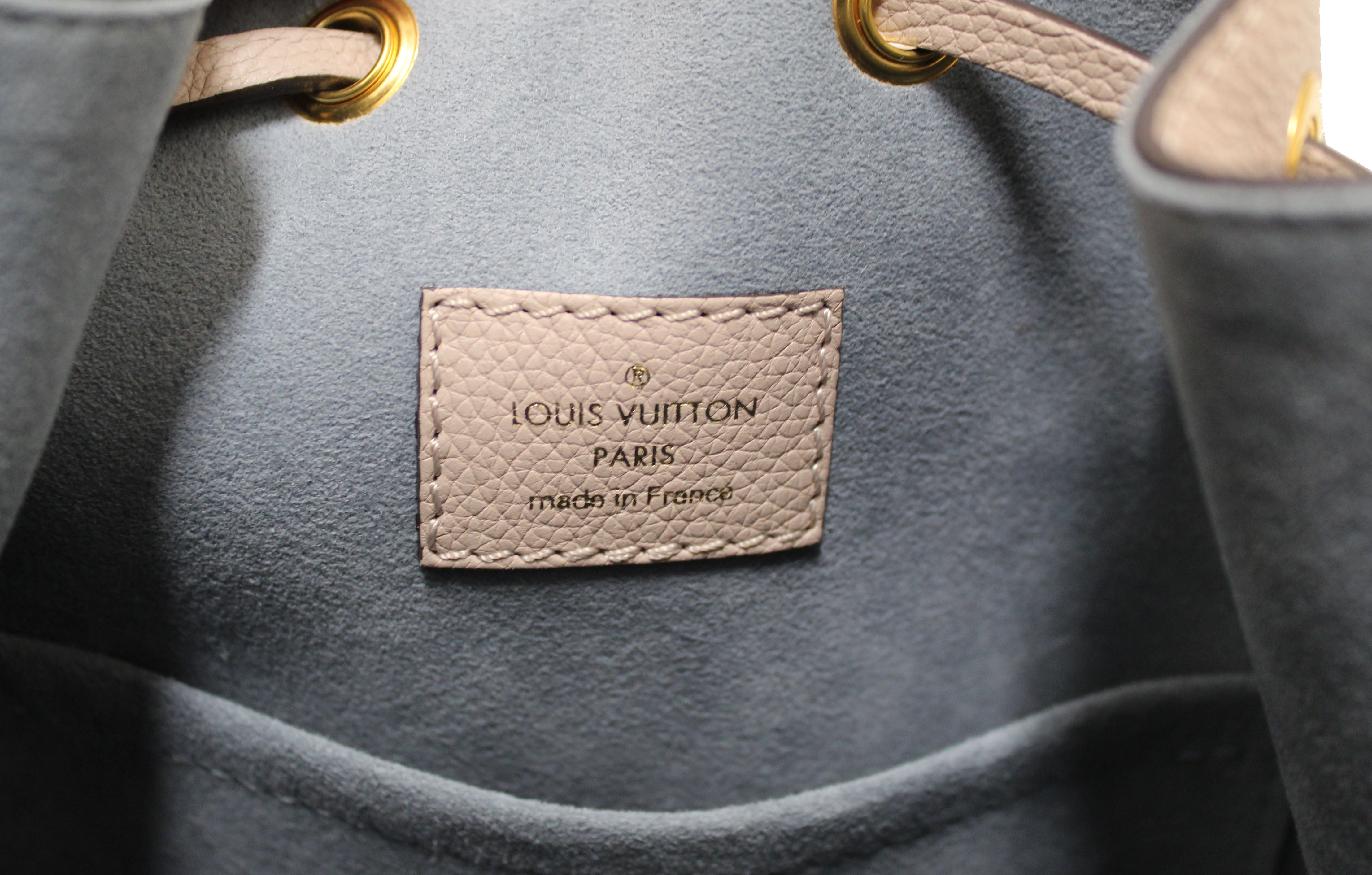 Authentic Louis Vuitton Beige Grained Calf Leather Lockme Bucket Bag