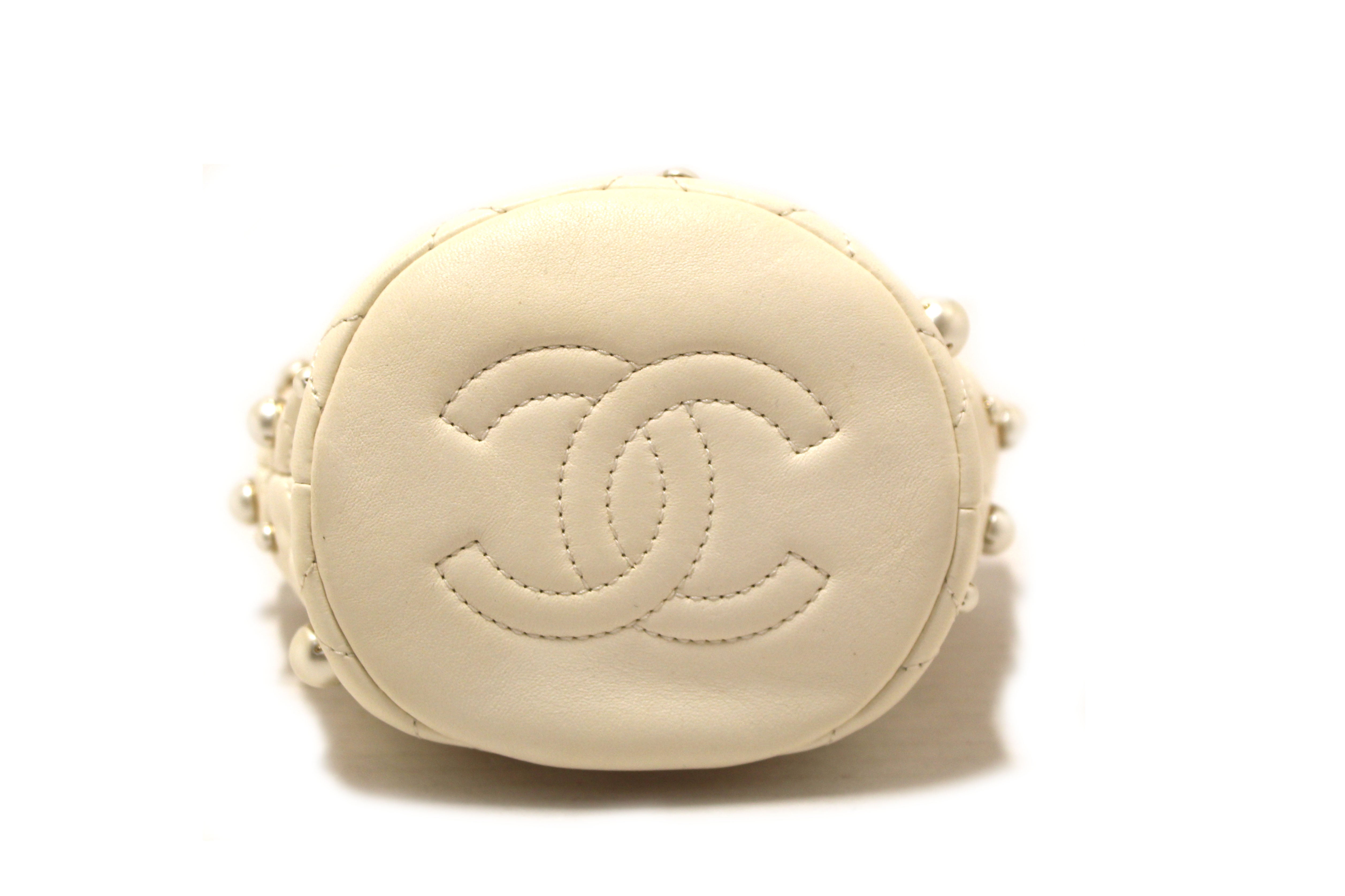 Authentic Chanel Quilted Lambskin with Pearls Mini Drawstring Bucket Bag