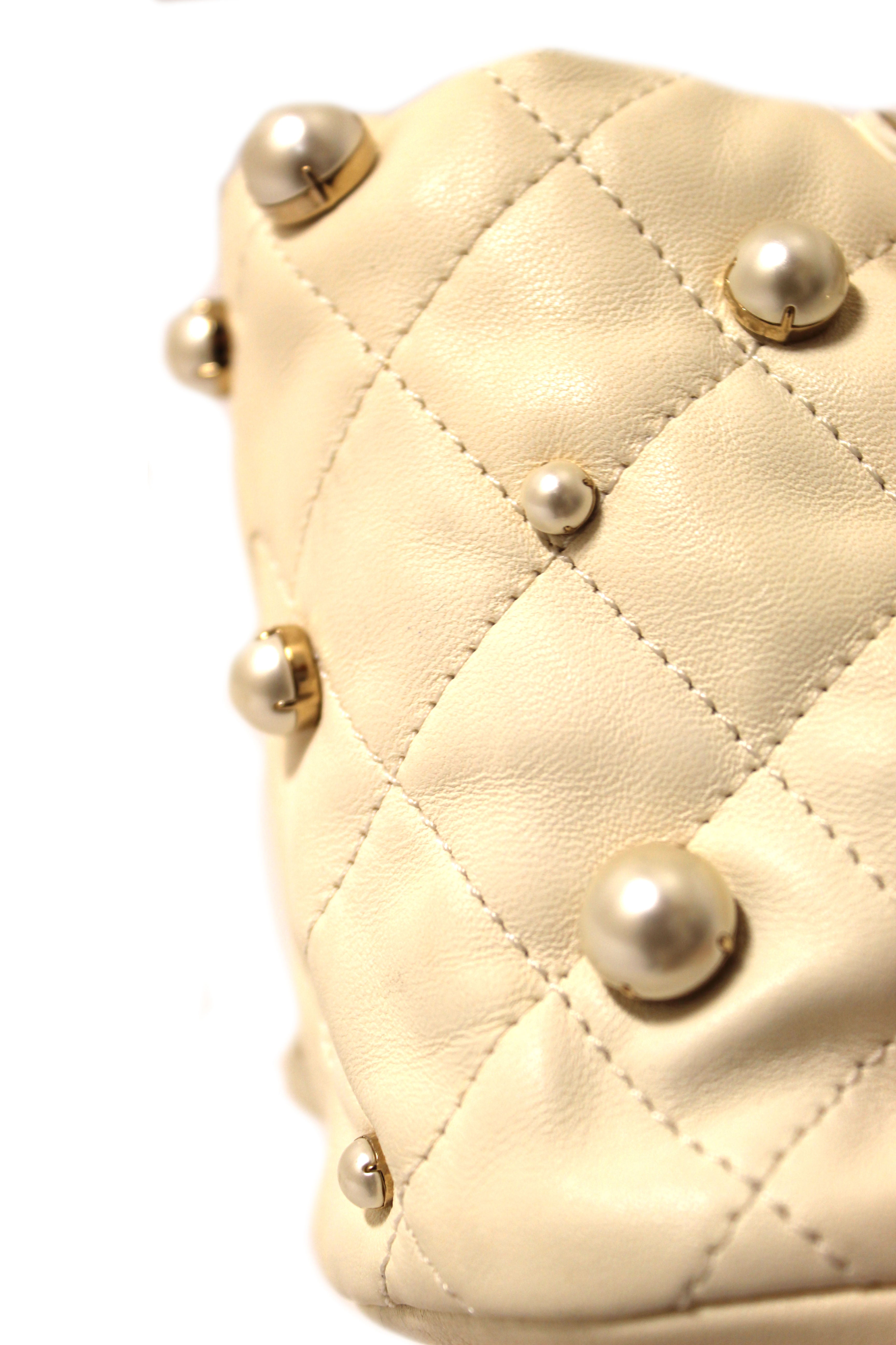 Authentic Chanel Quilted Lambskin with Pearls Mini Drawstring Bucket Bag