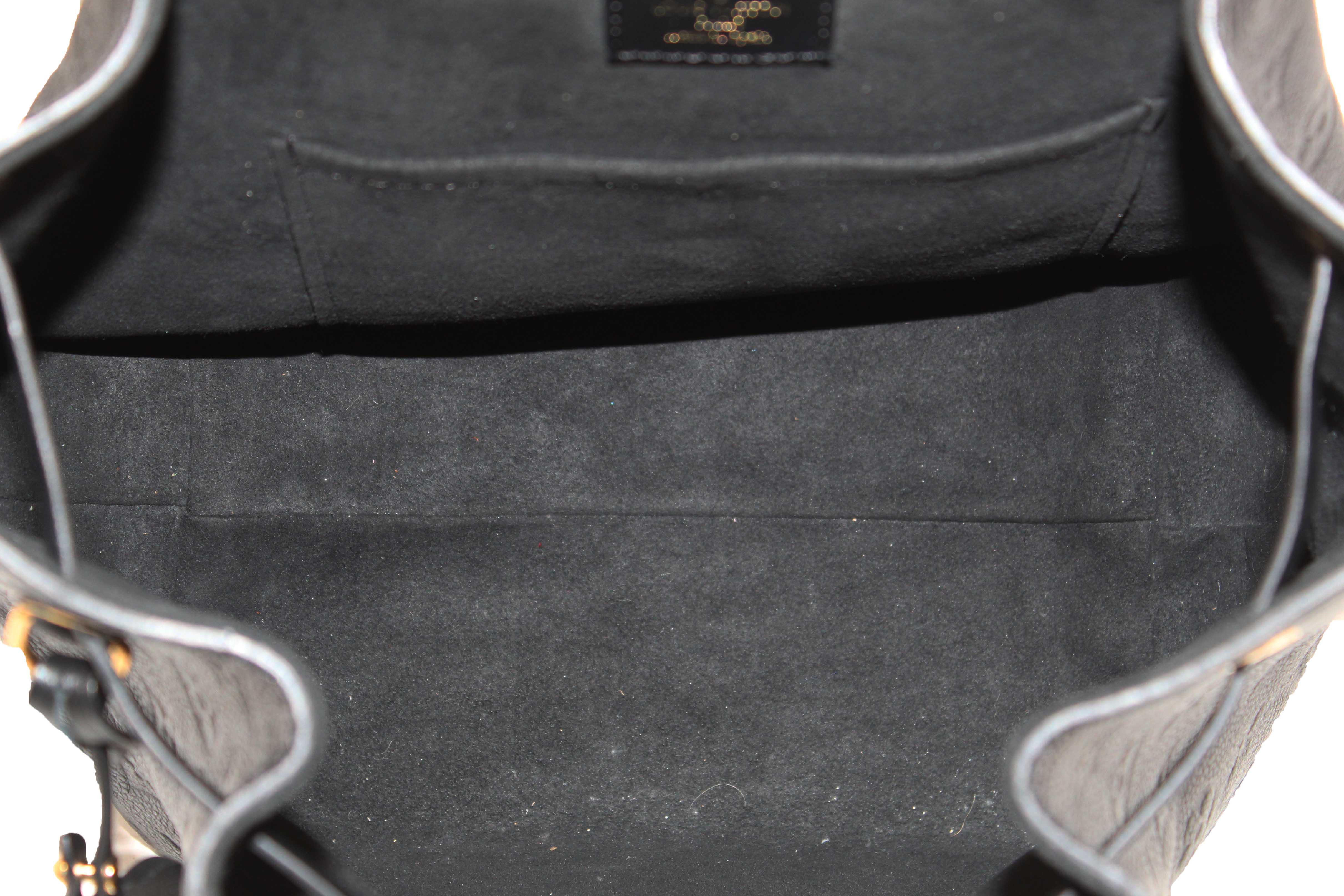 Authentic Louis Vuitton Black Monogram Empreinte Montsouris Backpack
