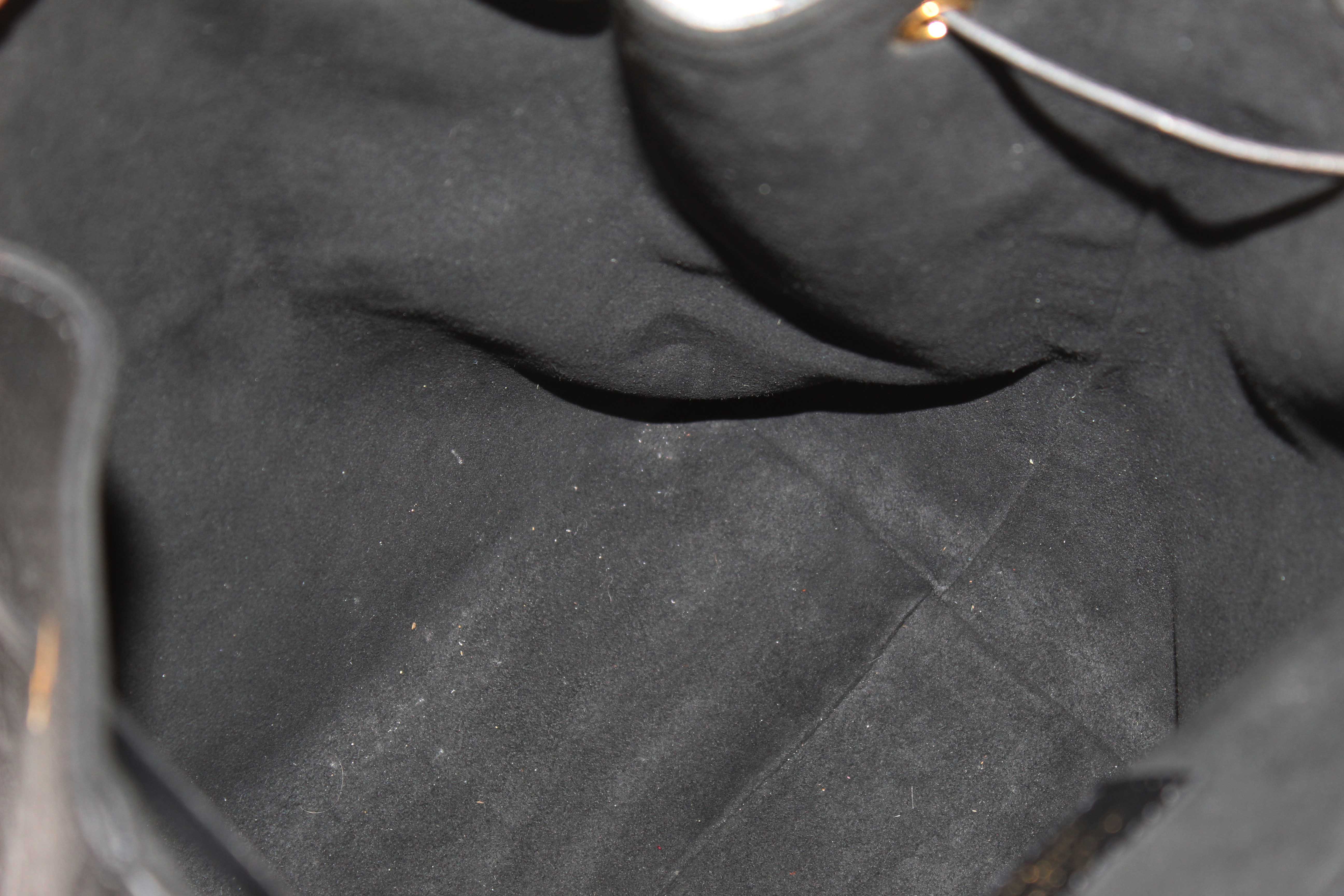 Authentic Louis Vuitton Black Monogram Empreinte Montsouris Backpack