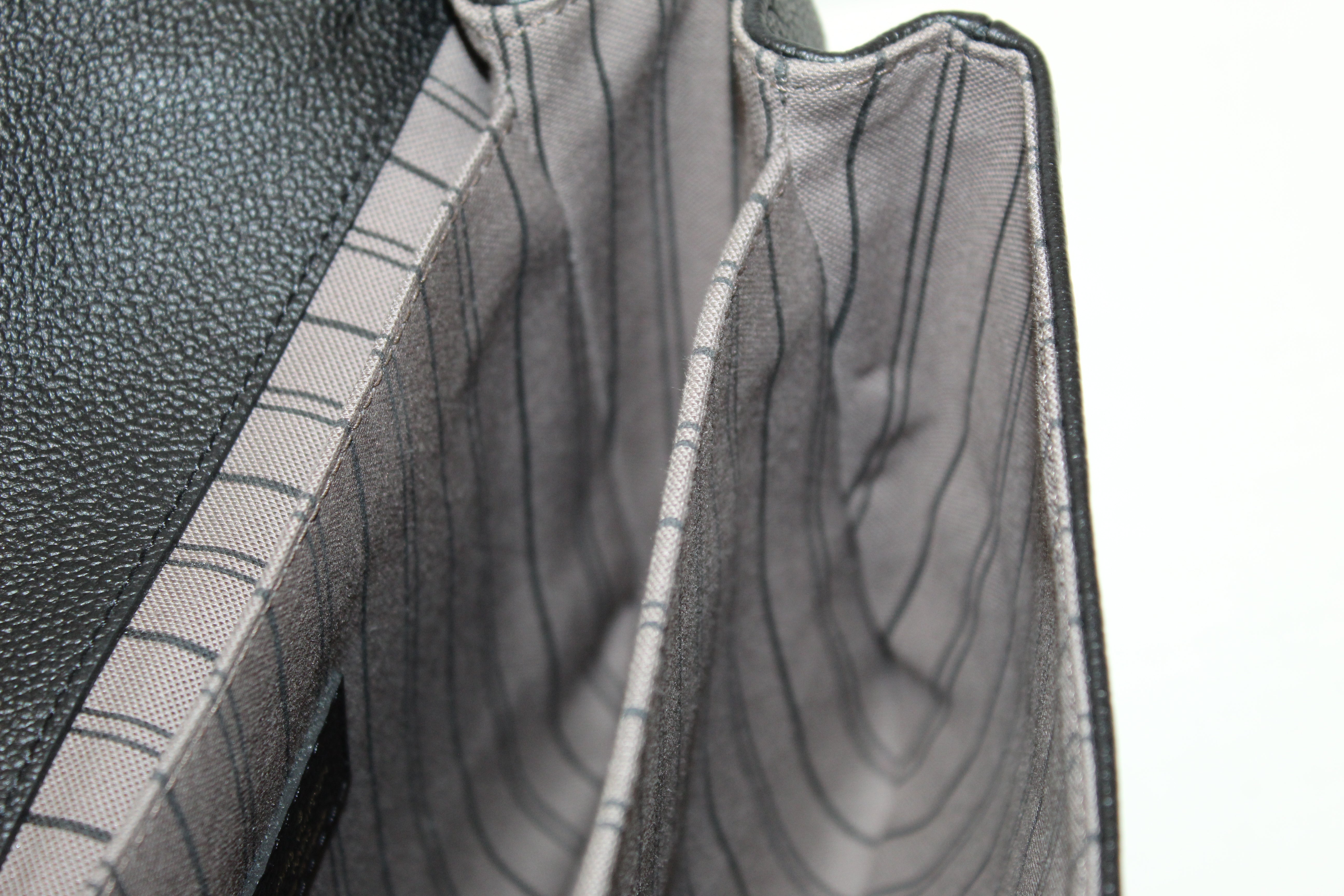 Authentic Louis Vuitton Black Monogram Empreinte Leather Metis