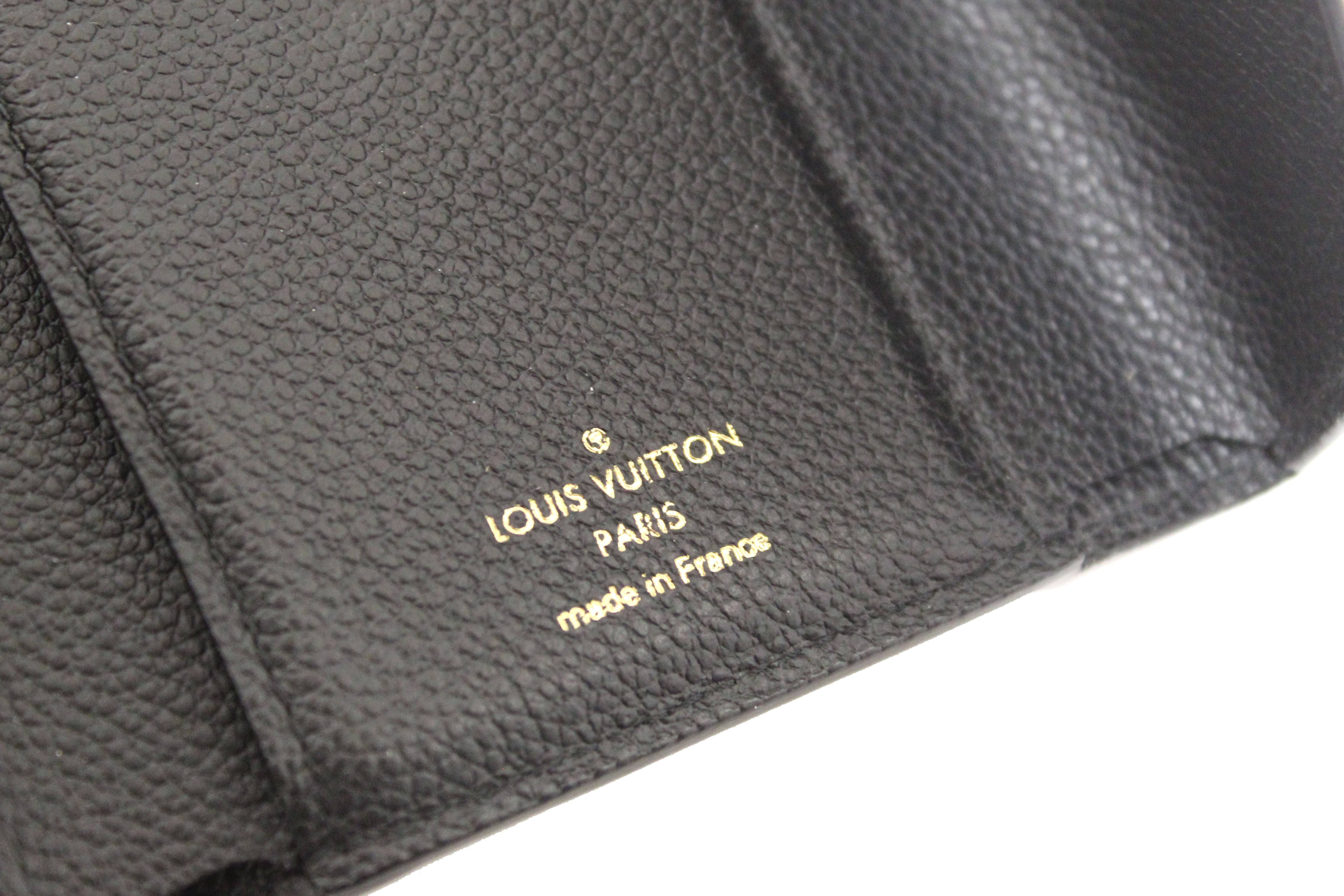 Authentic Louis Vuitton Black Monogram Empreinte Leather Victorine Wallet