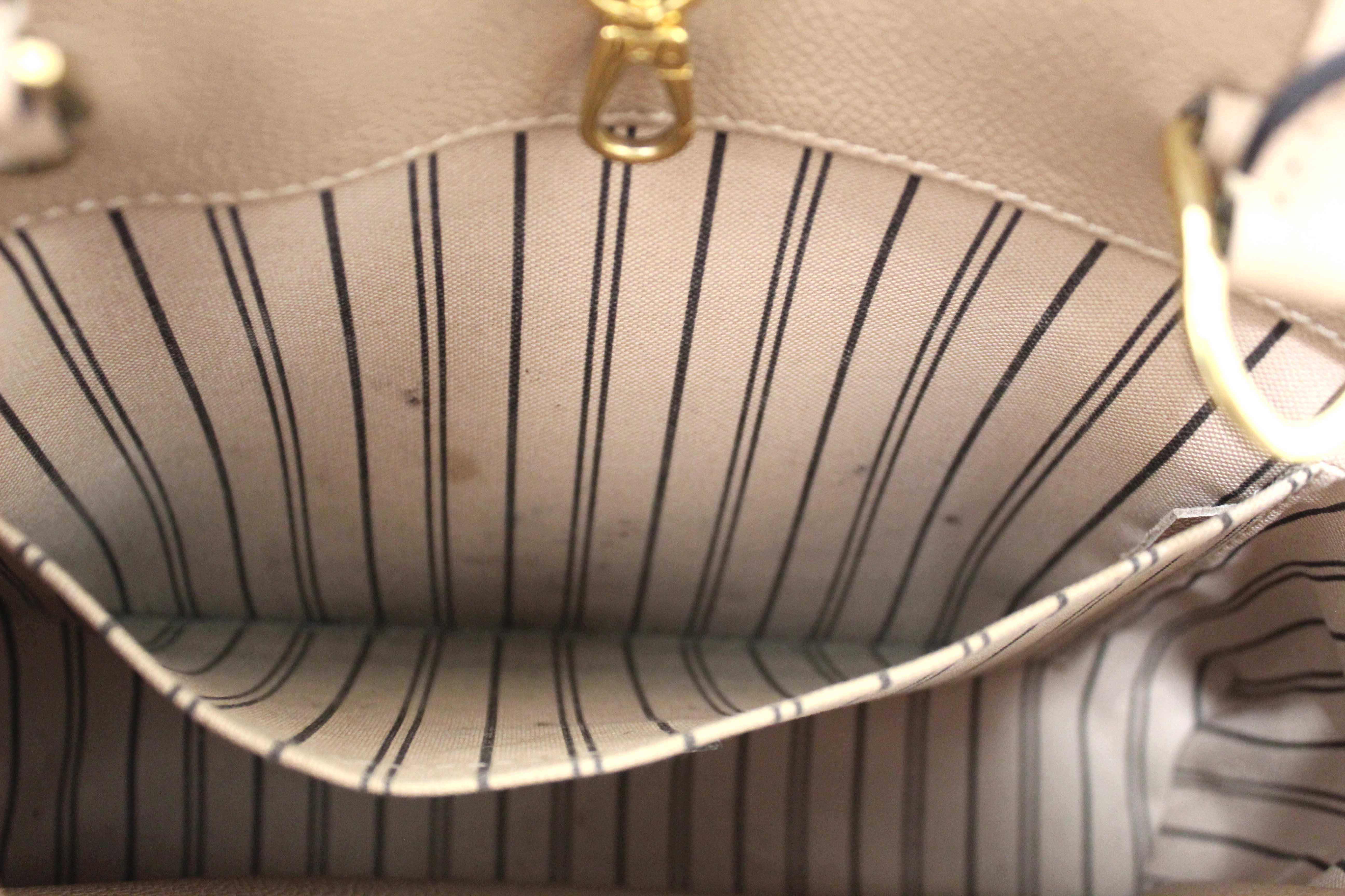 Authentic Louis Vuitton Beige Monogram Empreinte Leather Montaigne MM Bag