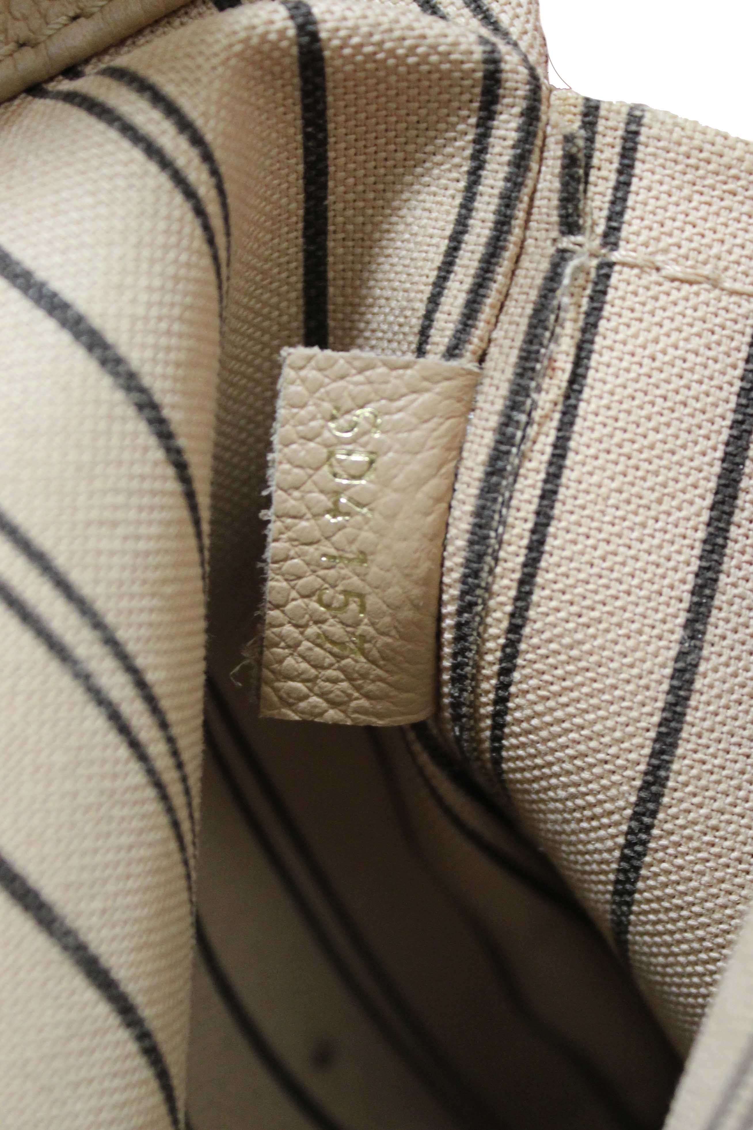 Authentic Louis Vuitton Beige Monogram Empreinte Leather Montaigne MM Bag