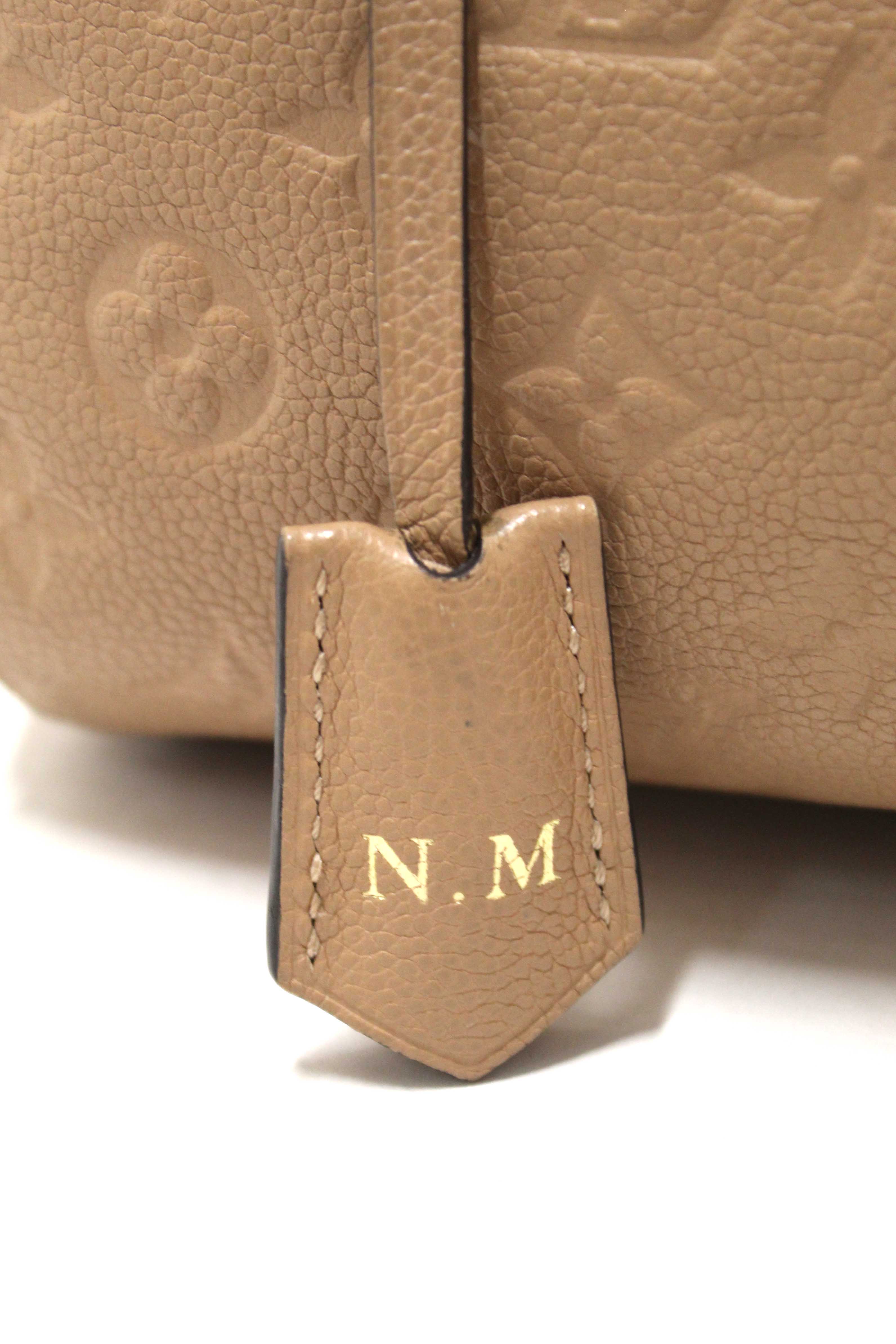 Authentic Louis Vuitton Beige Monogram Empreinte Leather Montaigne MM Bag