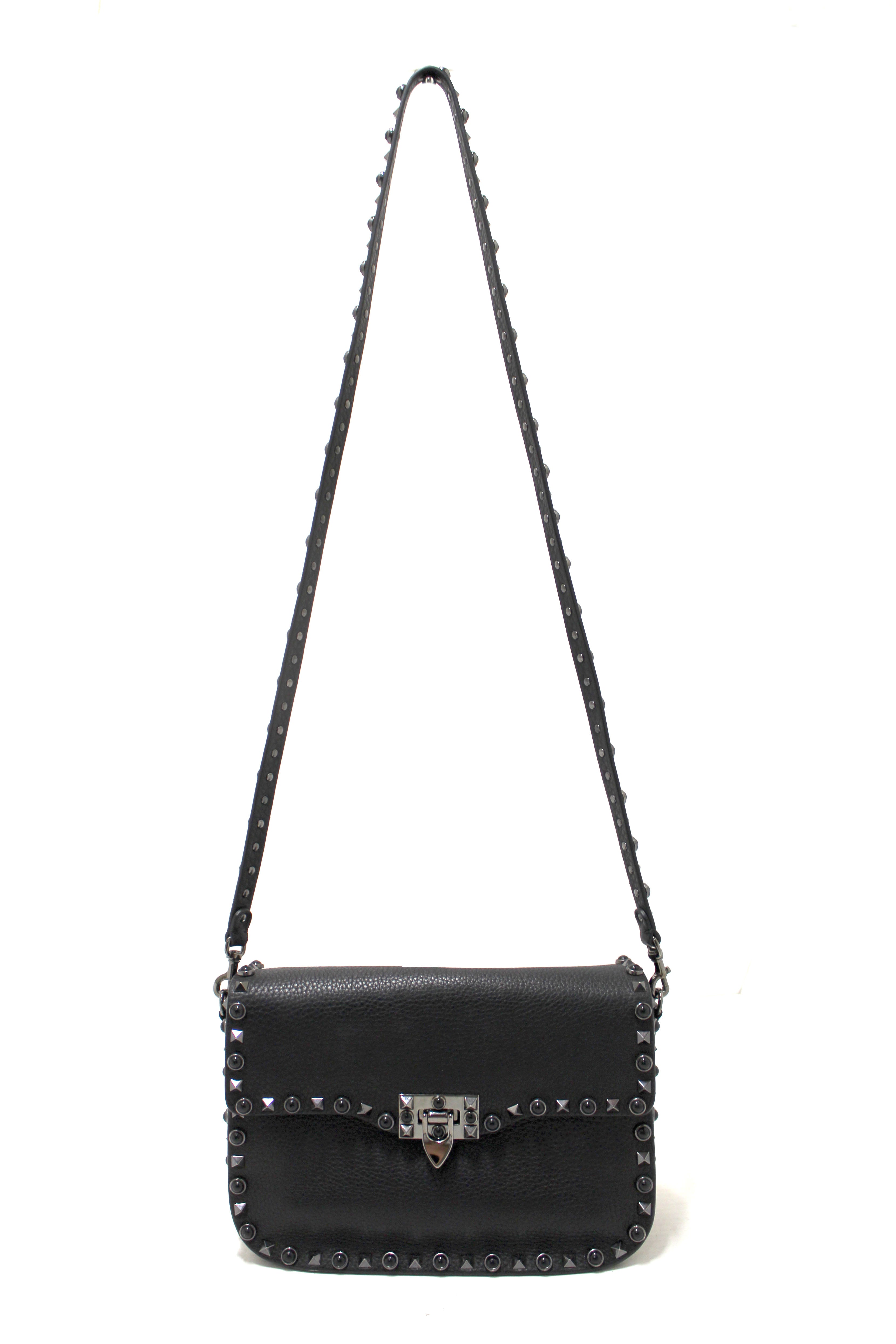 Authentic Valentino Garavani Black Grained Calfskin Rolling Rockstud Flap Crossbody Bag