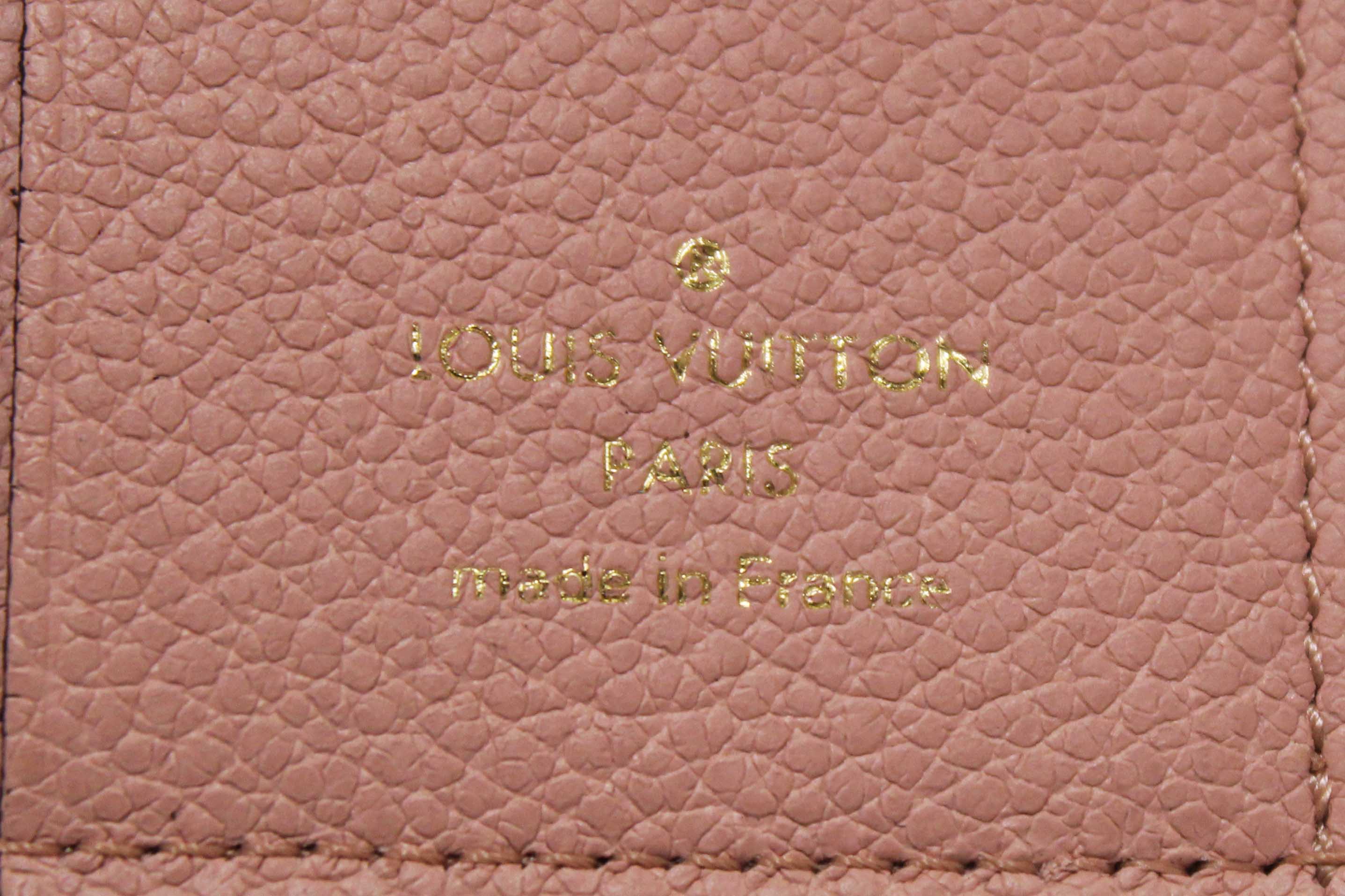 Authentic Louis Vuitton Pink Monogram Empreinte Leather Zoe Wallet