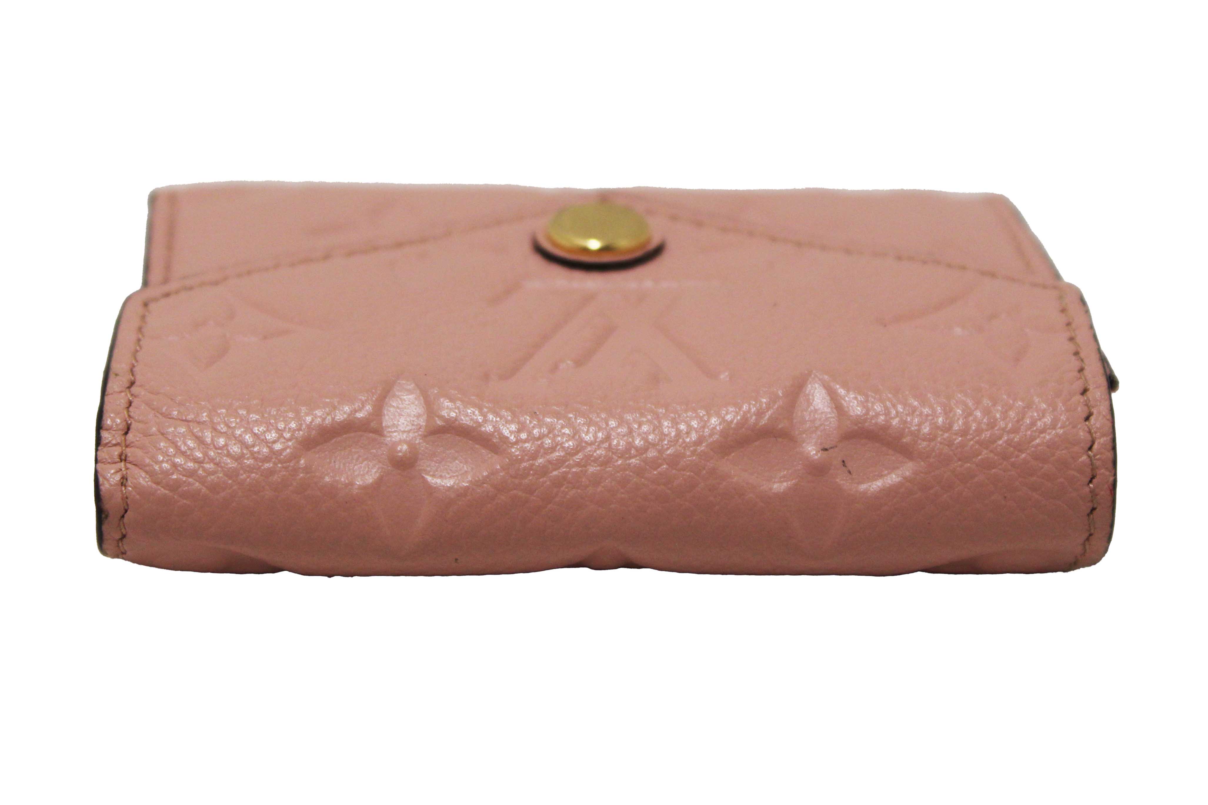 Authentic Louis Vuitton Pink Monogram Empreinte Leather Zoe Wallet