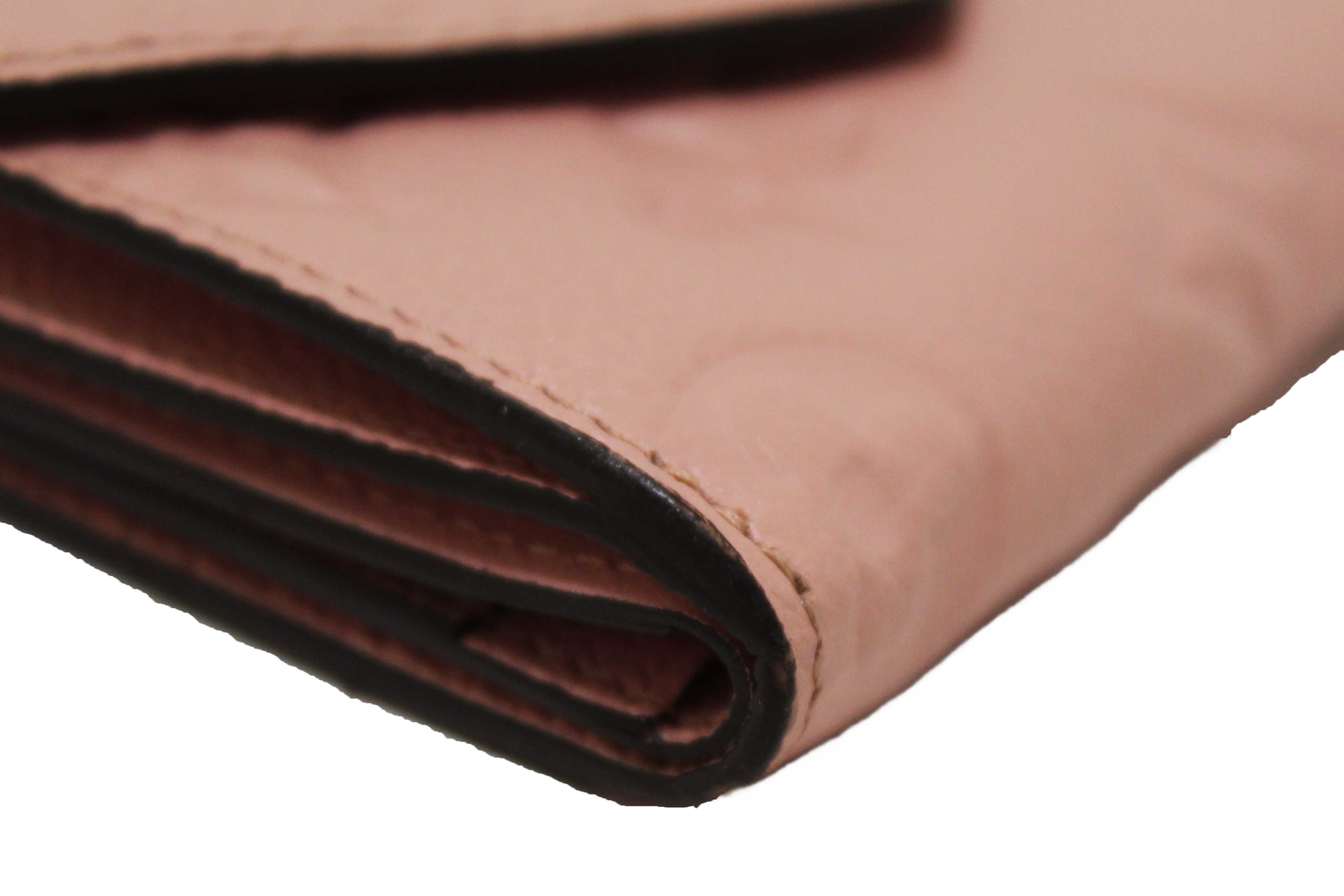 Authentic Louis Vuitton Pink Monogram Empreinte Leather Zoe Wallet