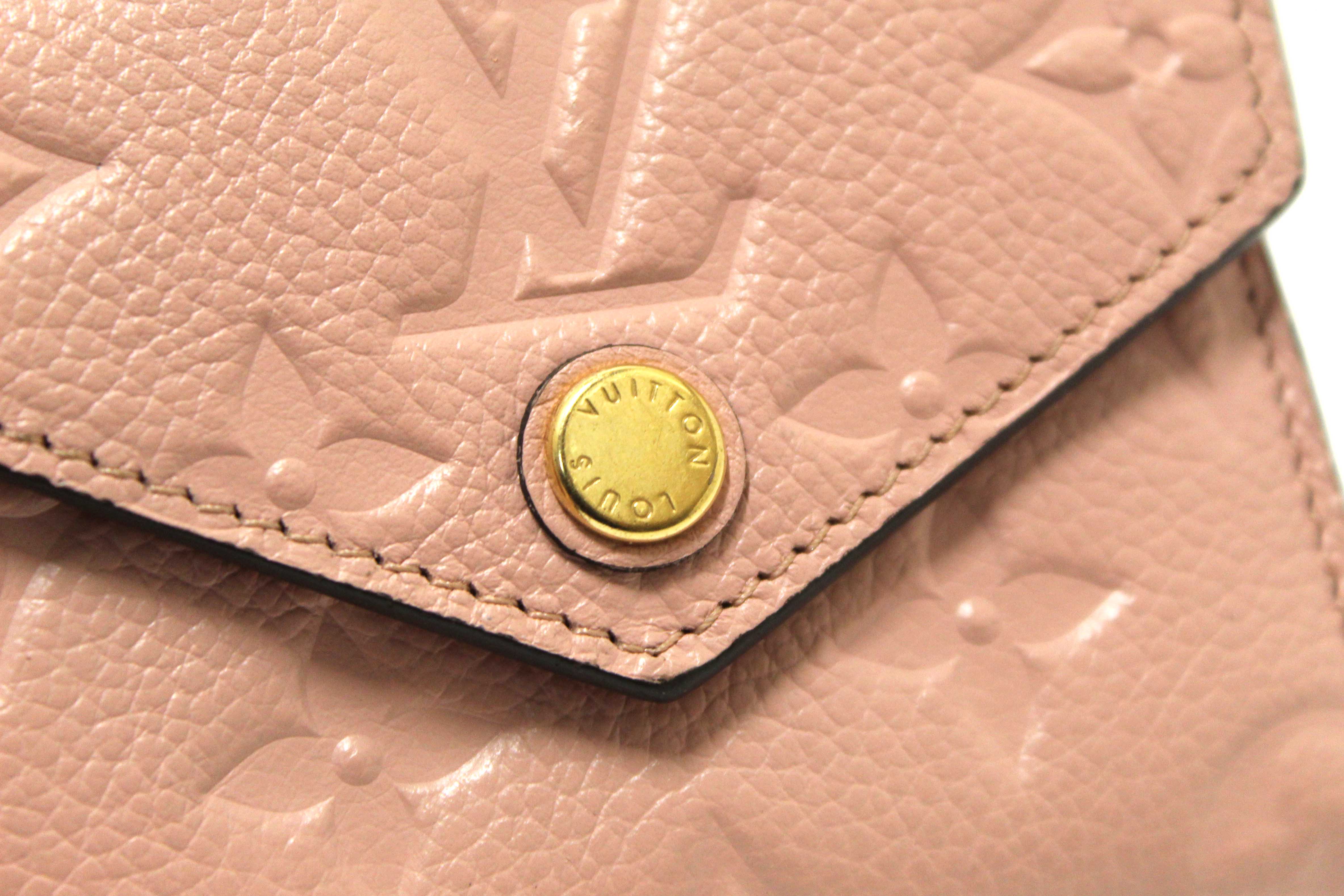 Authentic Louis Vuitton Pink Monogram Empreinte Leather Zoé Wallet