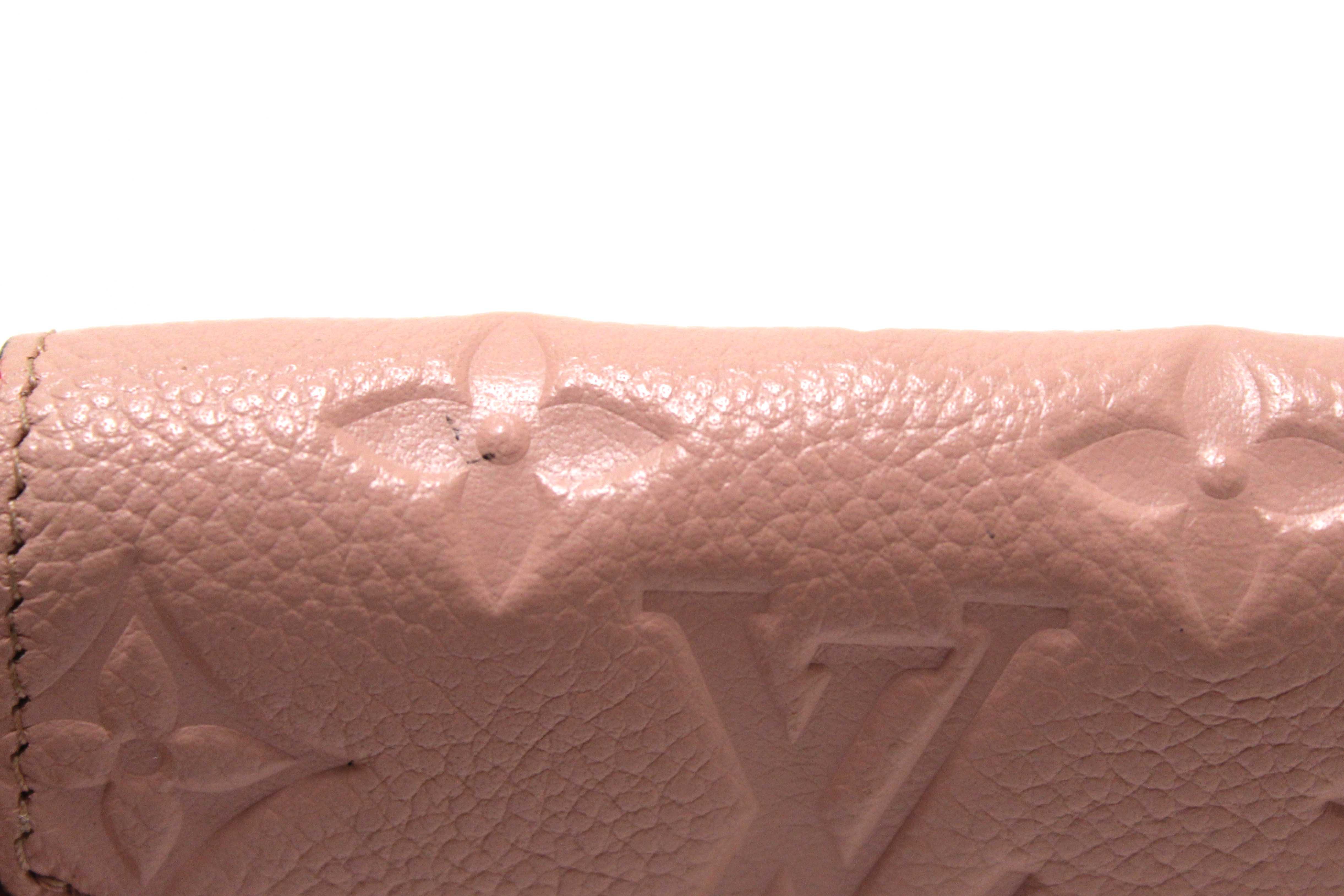 Authentic Louis Vuitton Pink Monogram Empreinte Leather Zoé Wallet