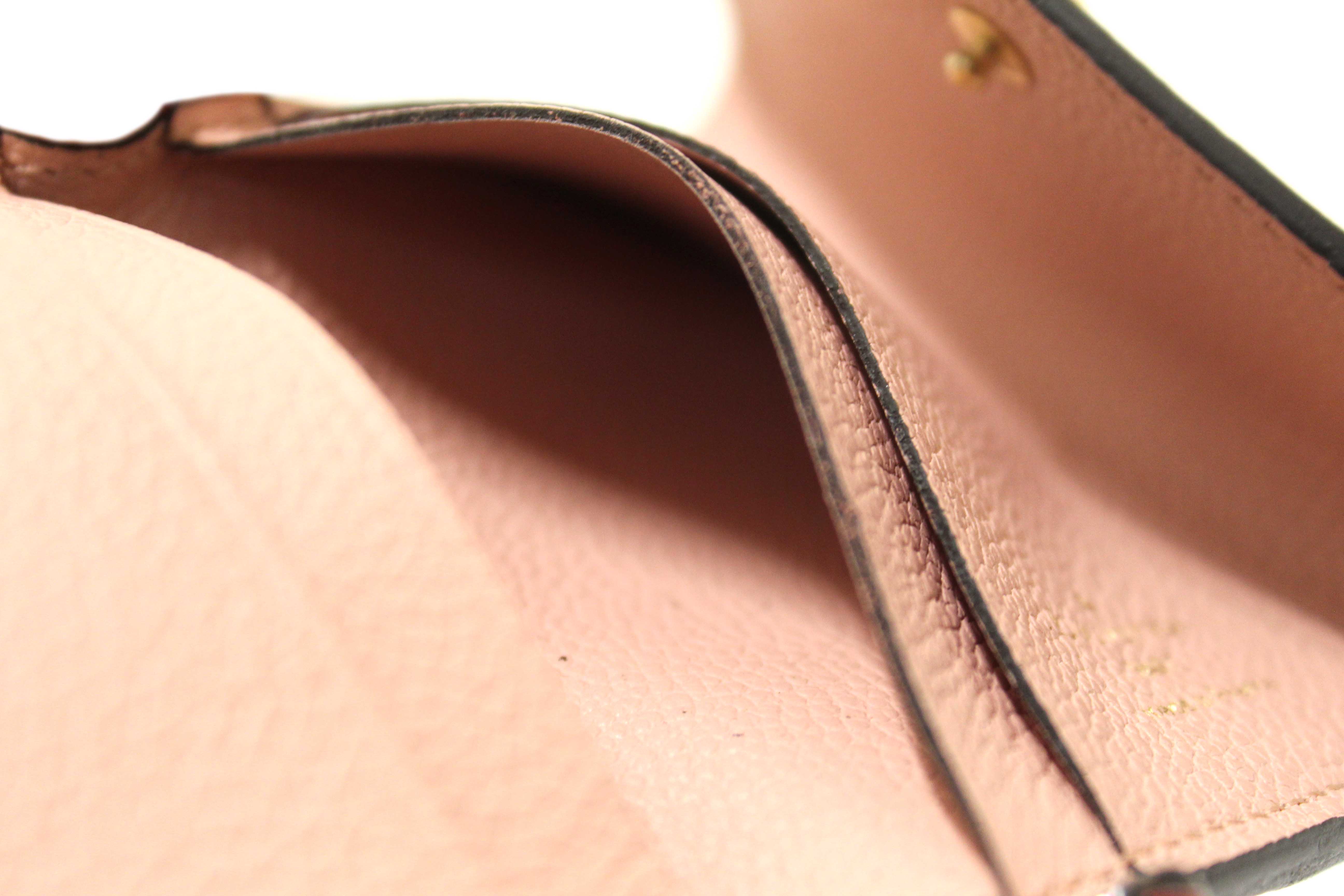 Authentic Louis Vuitton Pink Monogram Empreinte Leather Zoé Wallet